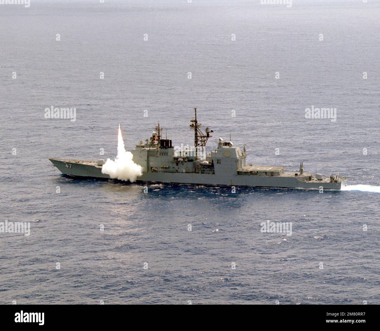 An RIM-66C Standard missile is fired from the forward Mark 26 Mod 1 launcher aboard the guided missile cruiser USS TICONDEROGA (CG-47). The missile is being fired at a target drone on the Atlantic Fleet Weapons Training Facility, Puerto Rico. Country: Atlantic Ocean (AOC) Stock Photo