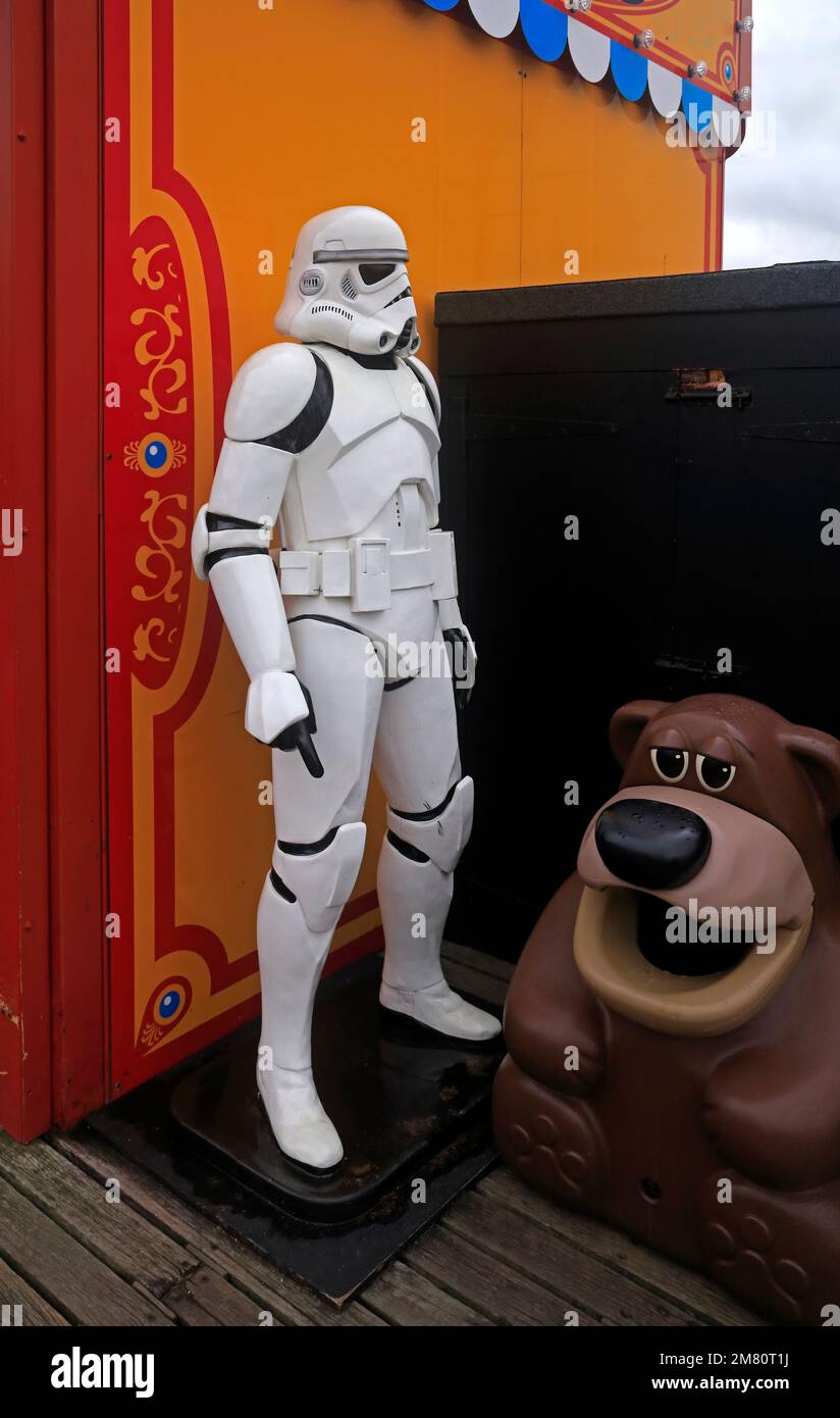 Storm Trooper Star Wars life size figure and bear rubbish bin, at Paignton pier, Devon. Taken January 2023 Stock Photo