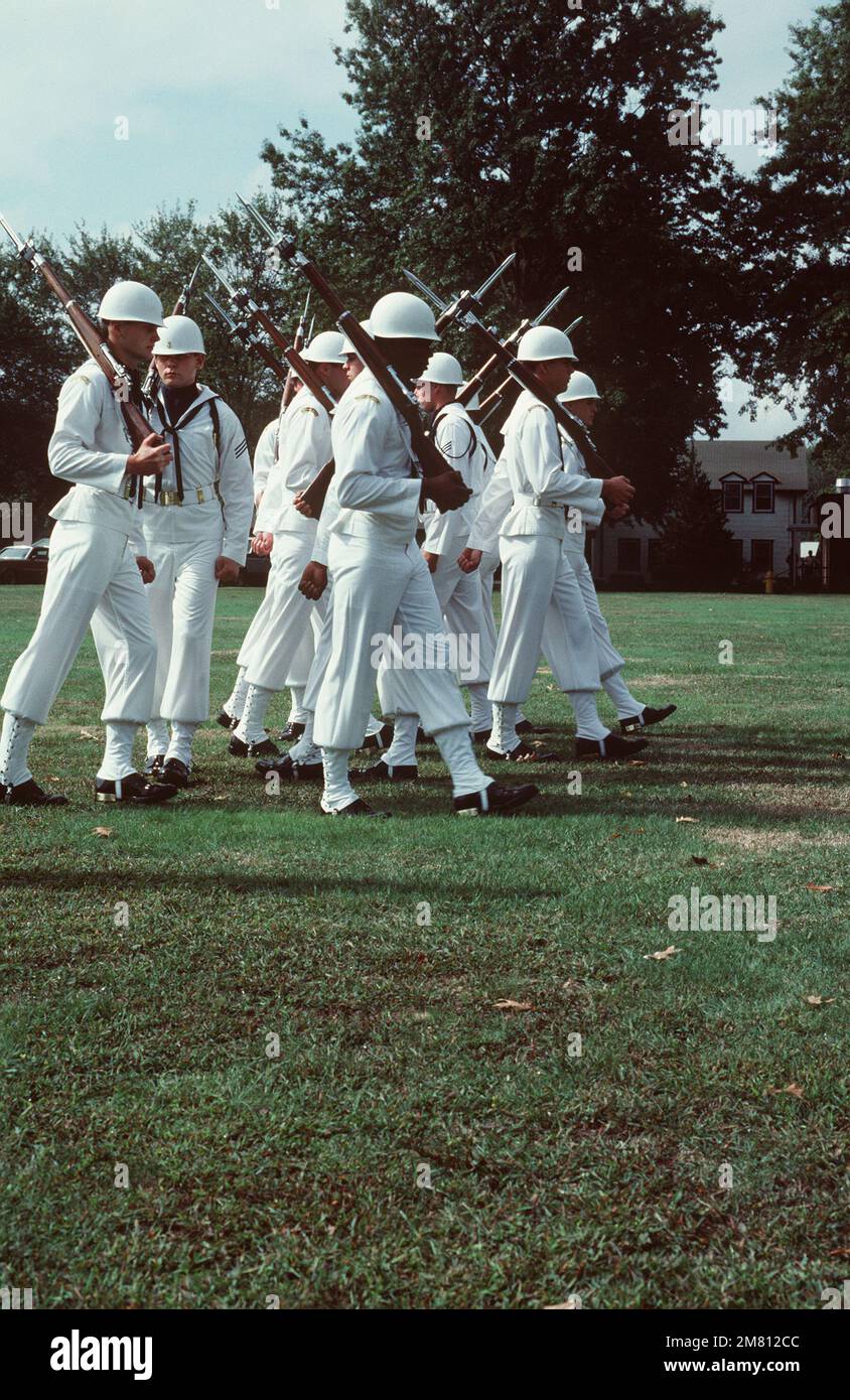 A Navy drill team performs during the commissioning ceremony for the