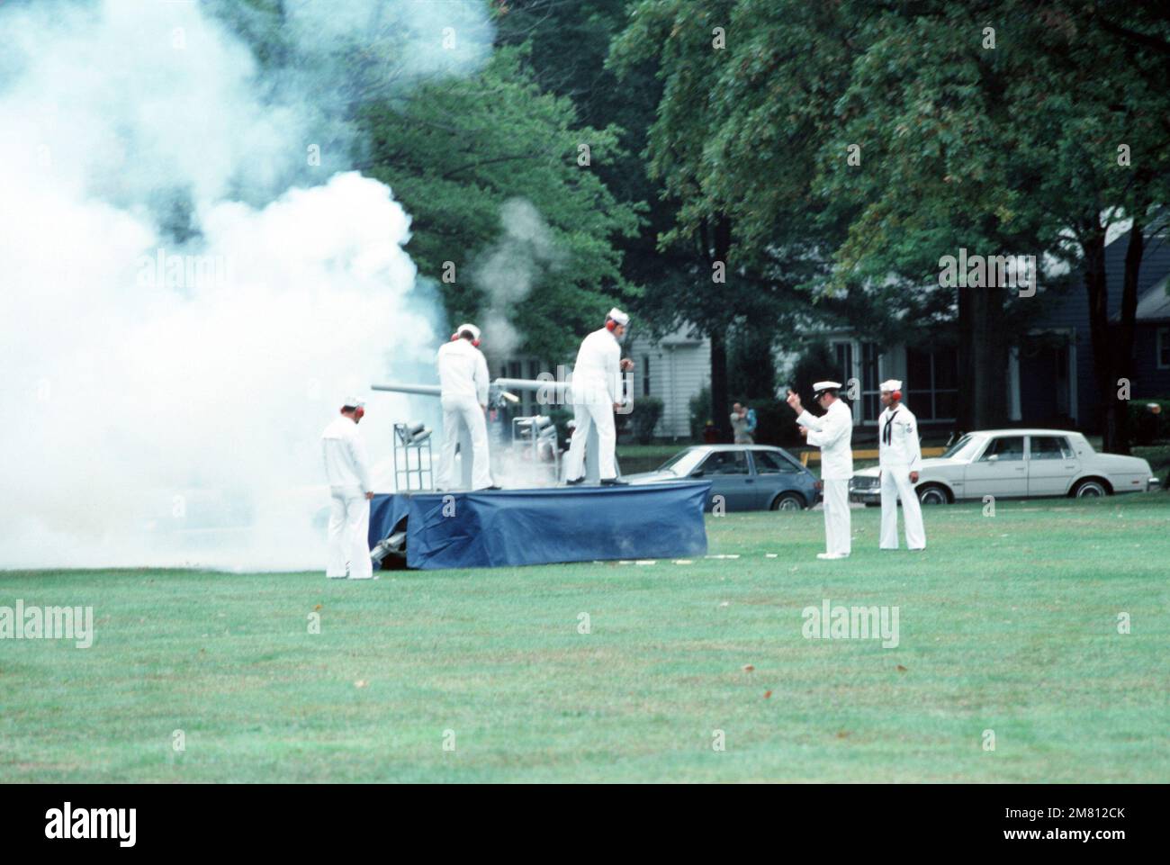Sailors fire a cannon salute during the commissioning ceremony for the