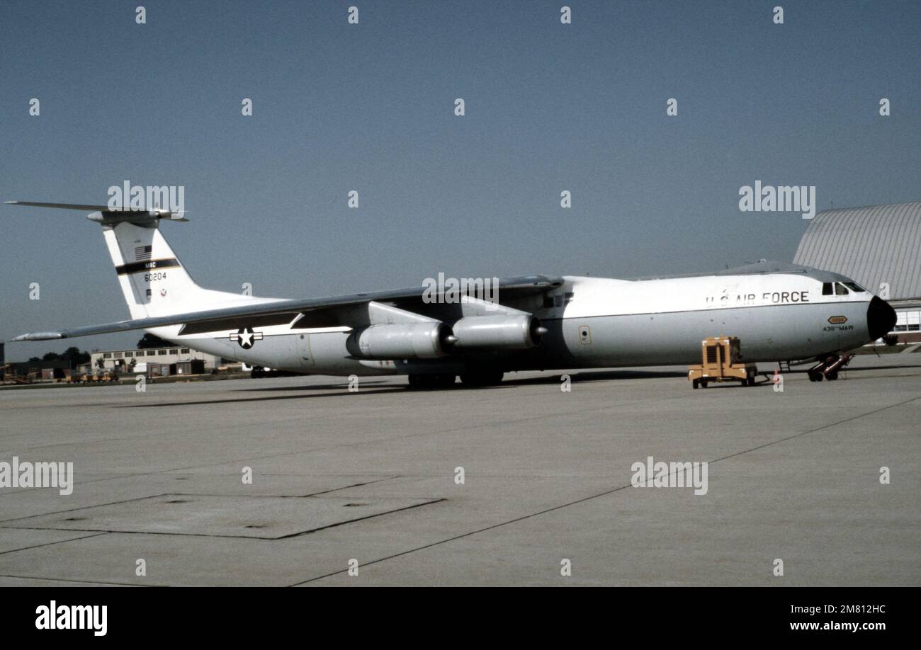 A right side view of a C-141B Starlifter aircraft parked on the flight ...