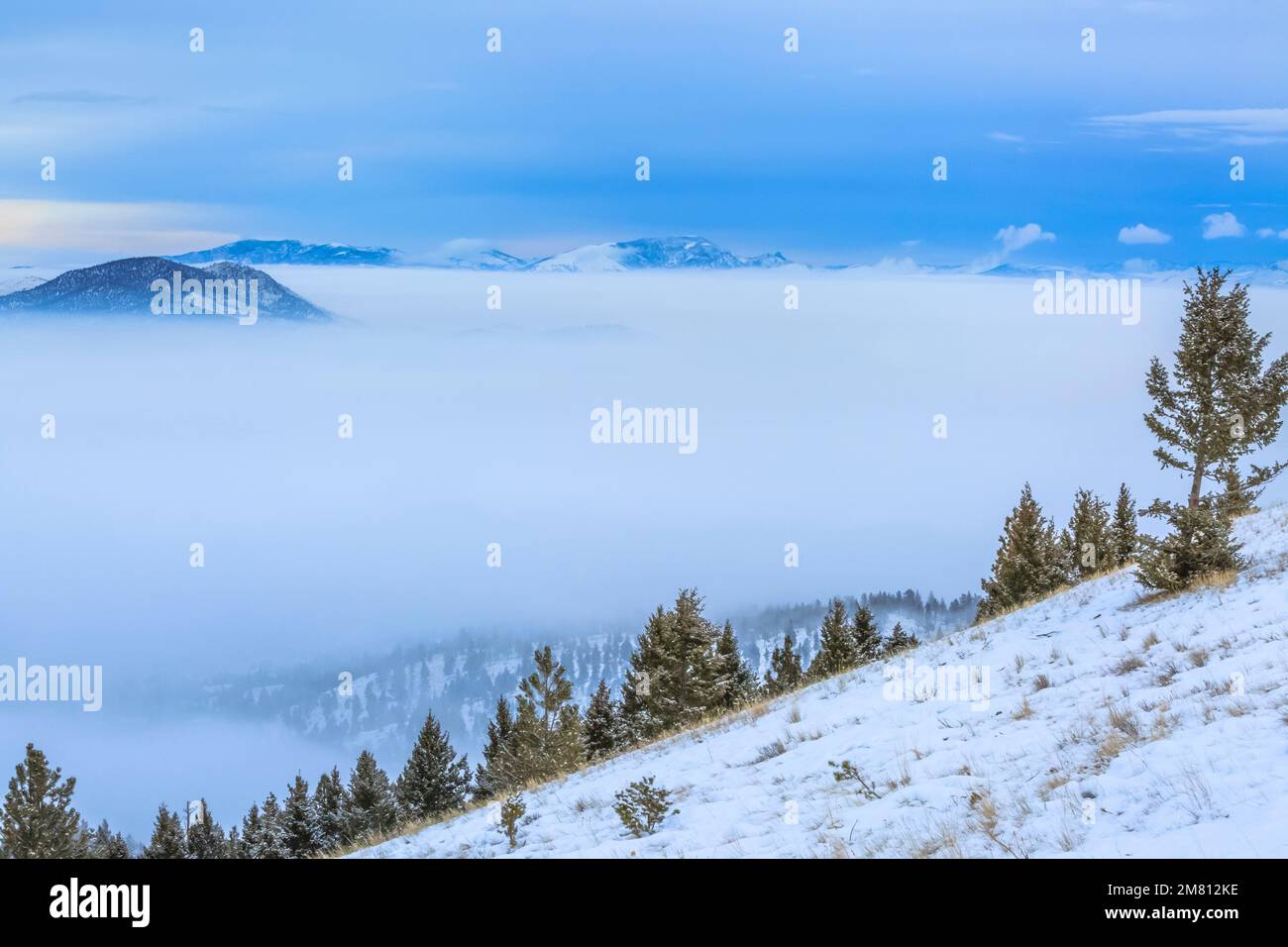 dense winter fog in the helena valley and distant sleeping giant mountain viewed from mount