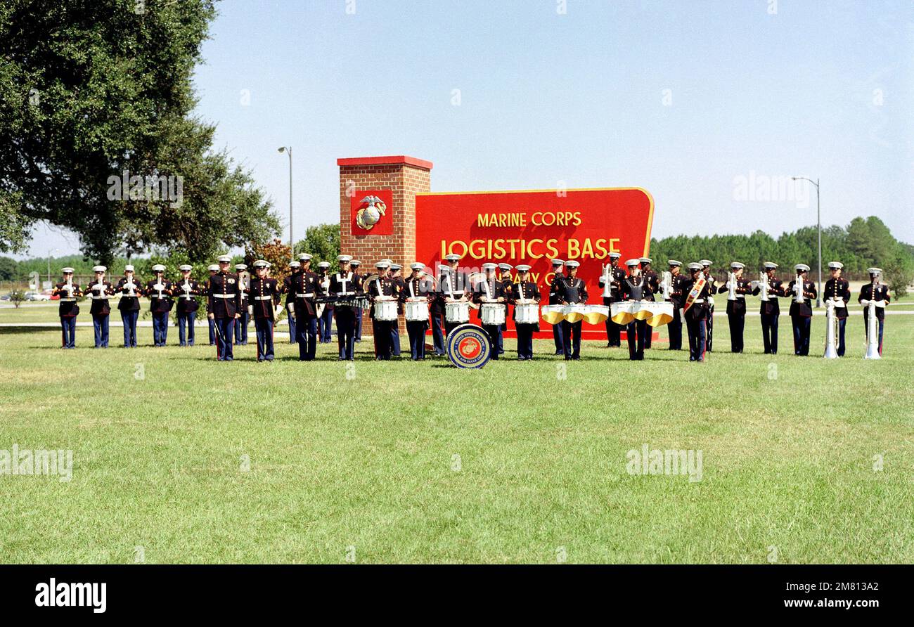 The Drum and Bugle Corps of the Marine Corps Logistics Base stands in