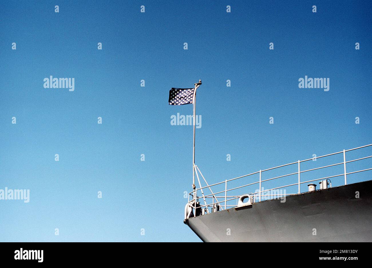 The union jack flies from the bow of a United States warship. Base: Naval Station, Norfolk State: Virginia (VA) Country: United States Of America (USA) Stock Photo