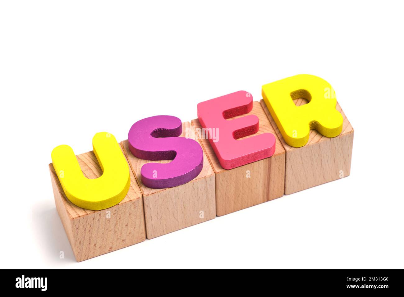 Word user is laid out on wooden cubes and on a white background Stock Photo