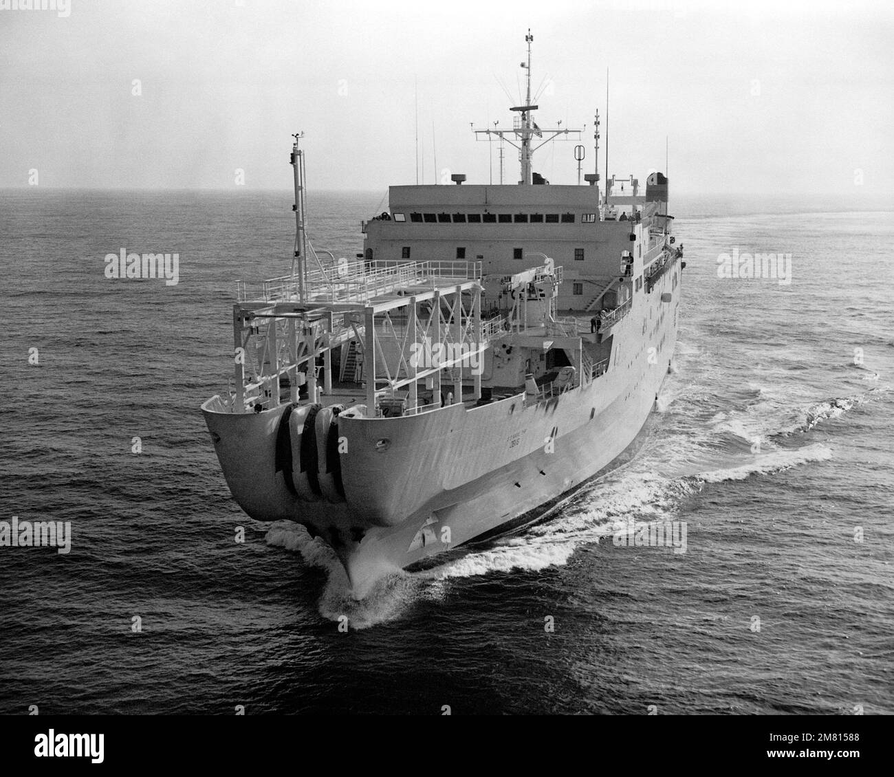 A port bow view of the cable repairing ship USNS ZEUS (T-ARC 7) underway during sea trials. Country: Unknown Stock Photo