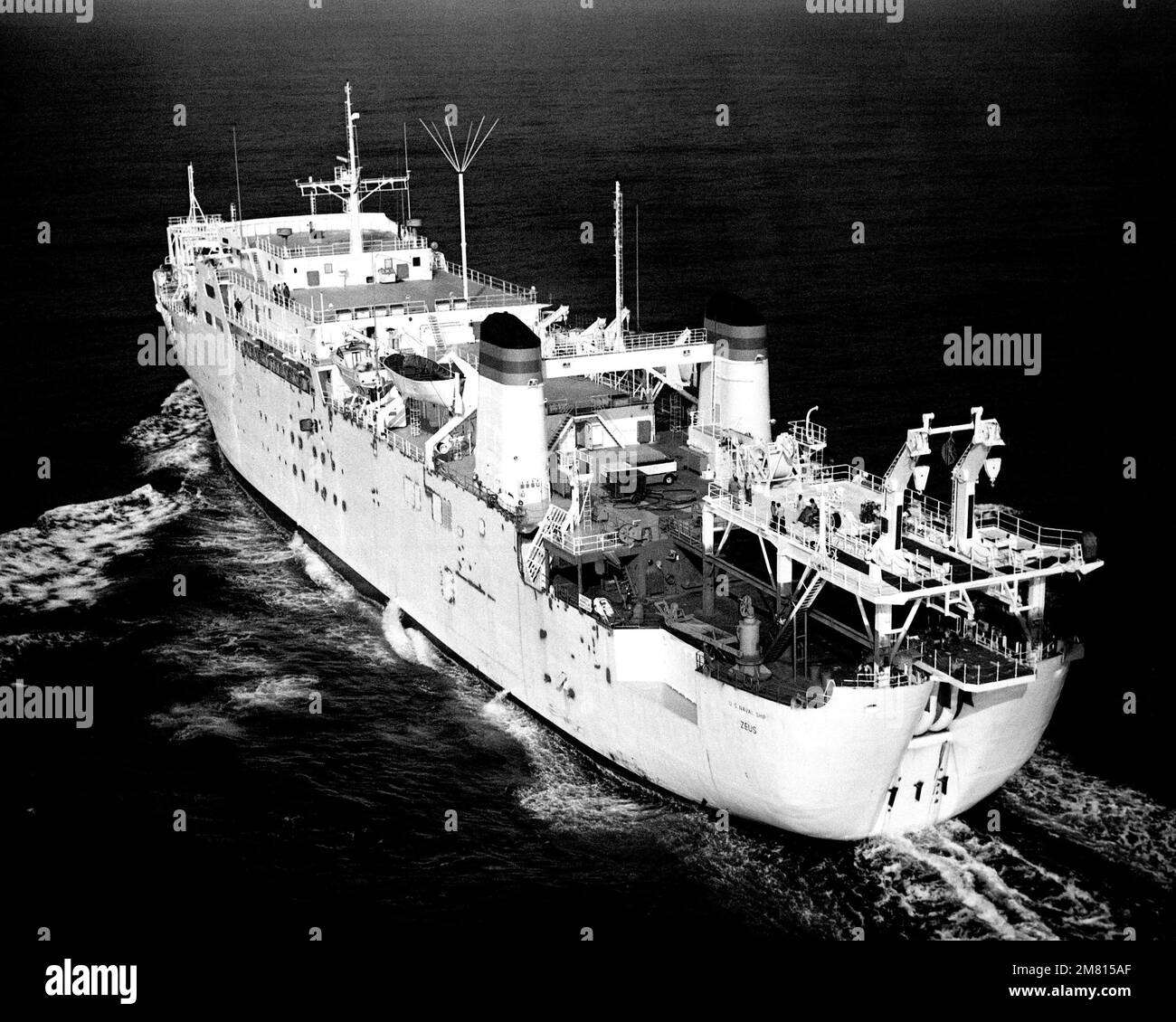 A port quarter view of the cable repairing ship USNS ZEUS (T-ARC 7) underway during sea trials. Country: Unknown Stock Photo
