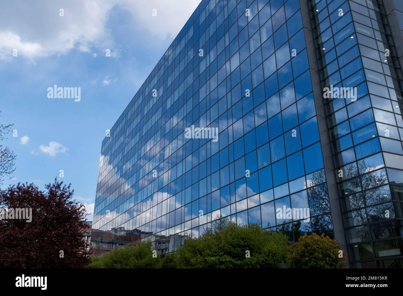 Modern office building with blue sky Stock Photo - Alamy