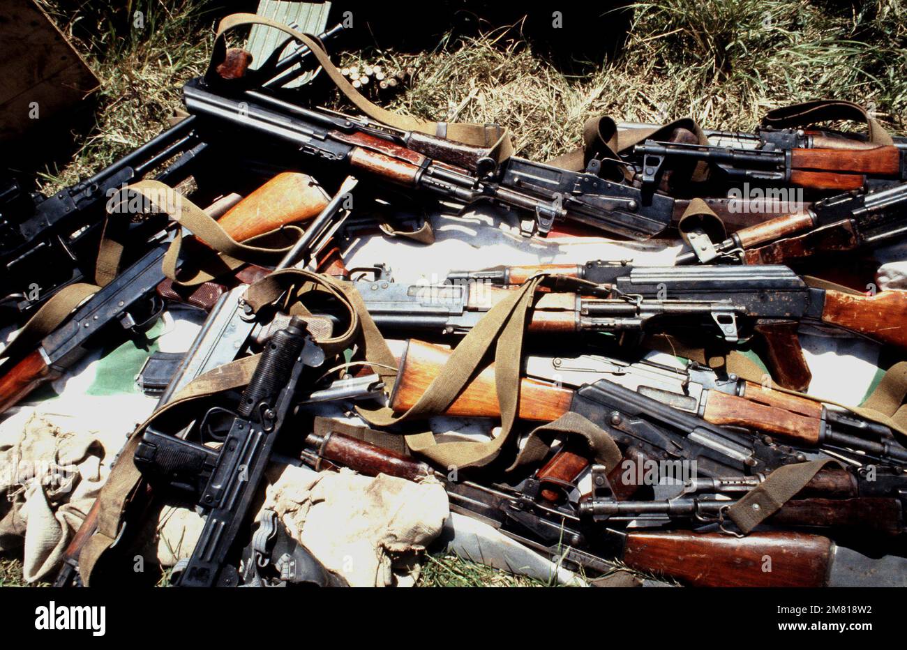 Among the weapons seized during the multi-service, multinational Operation URGENT FURY, are an UZI 9 mm submarine gun, a light machine gun, and assorted AK-47 assault rifles. Subject Operation/Series: URGENT FURY Country: Grenada (GRD) Stock Photo