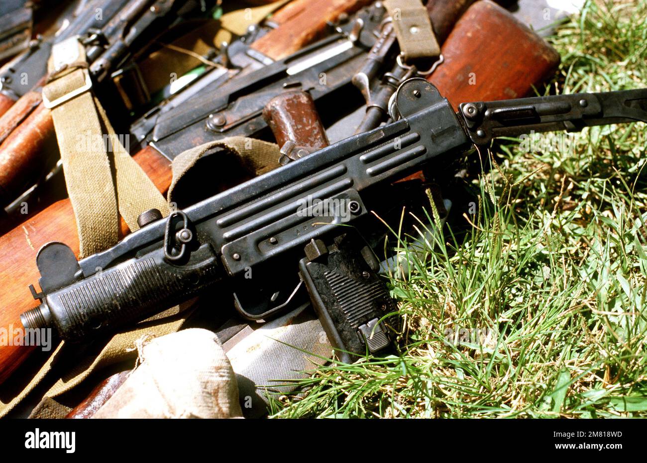 An UZI 9-mm submarine gun and AK-47 assault rifles seized during the multi-service, multinational Operation URGENT FURY. Subject Operation/Series: URGENT FURY Country: Grenada (GRD) Stock Photo