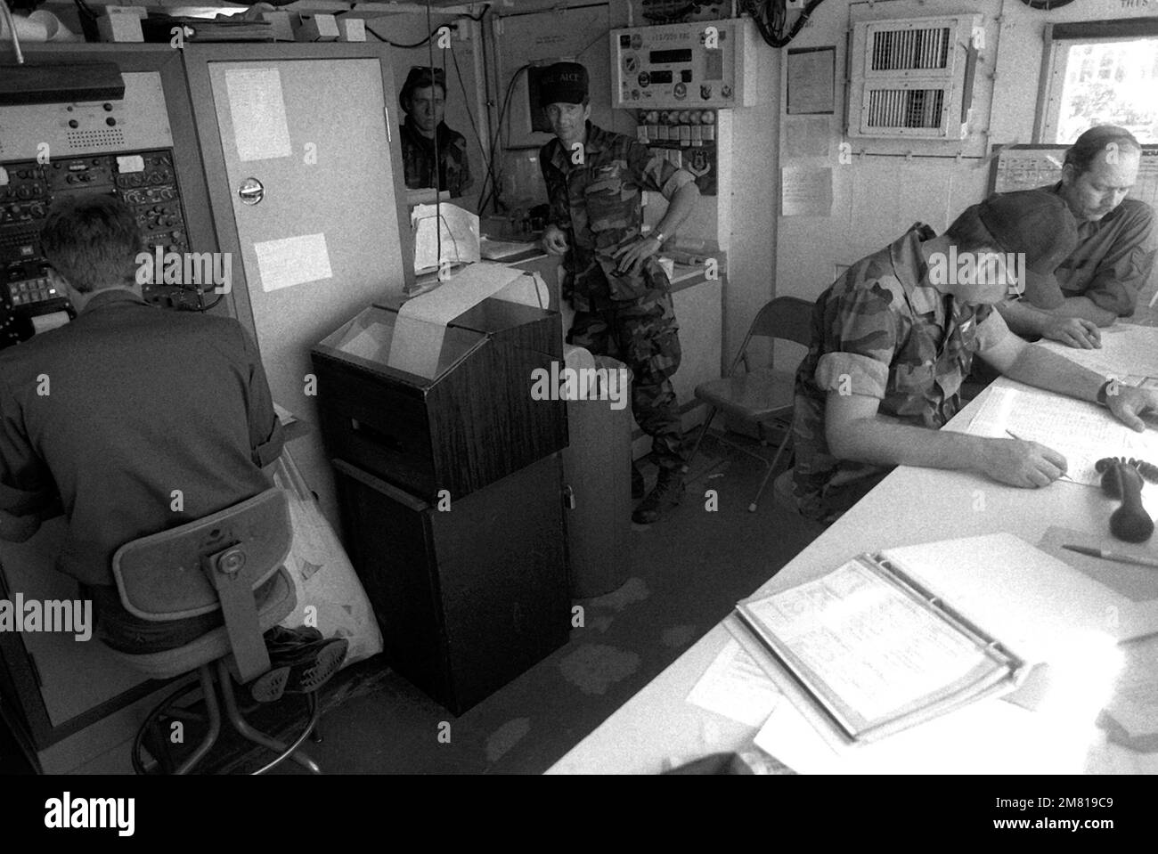 Airlift Control Element (ALCE) personnel work in the control center during support operations for the multiservice, multinational Operation Urgent Fury. Subject Operation/Series: URGENT FURY Base: Seawell International Airport Country: Bangladesh (BGD) Stock Photo