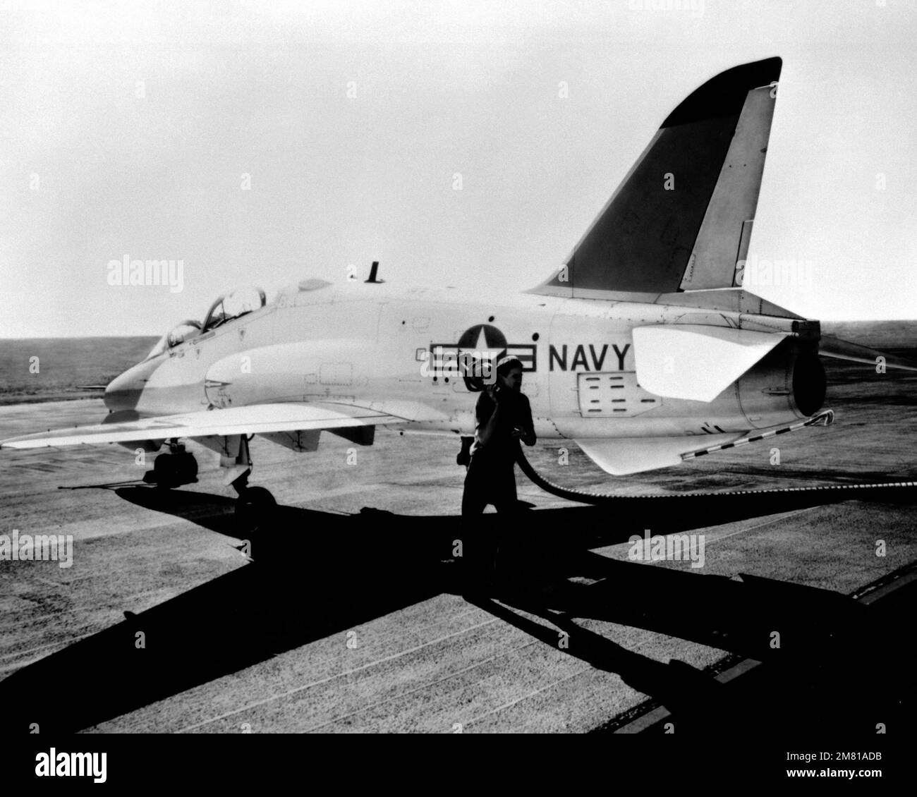 A left rear of a T45A Hawk aircraft being refueled on the flight deck