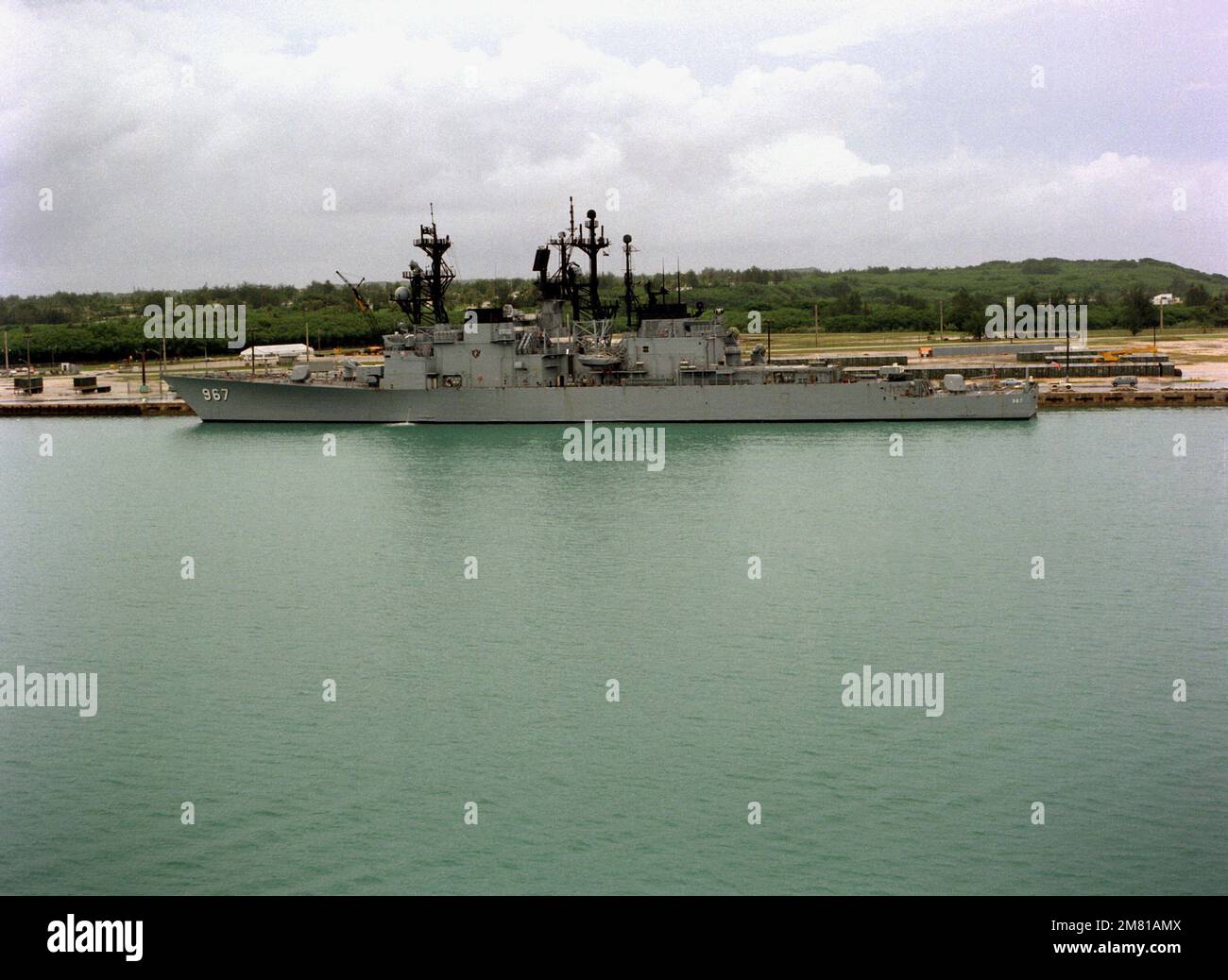 A port beam view of the destroyer USS ELLIOTT (DD-967) moored in the ...