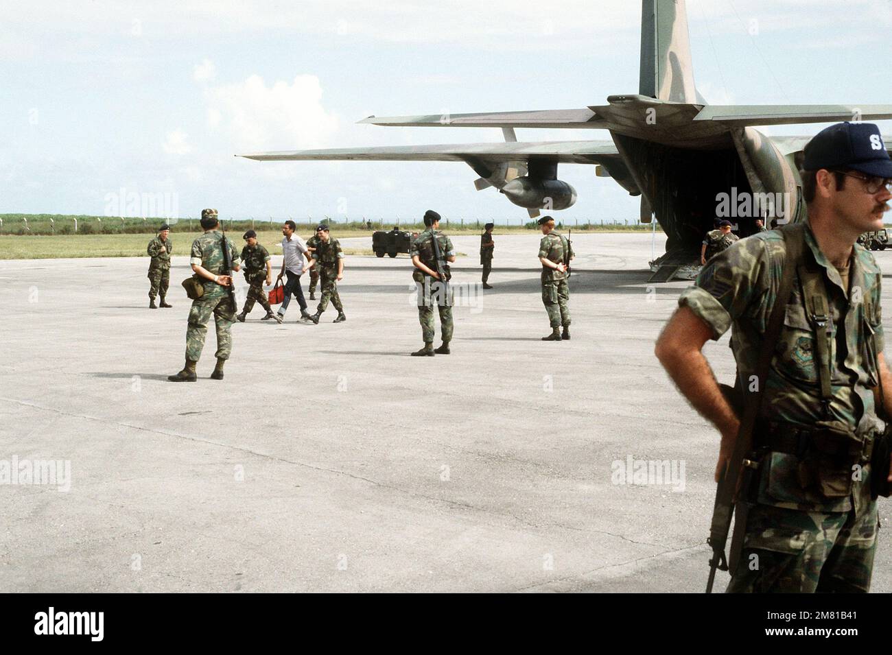 U s air force security police stand guard as cuban national captured