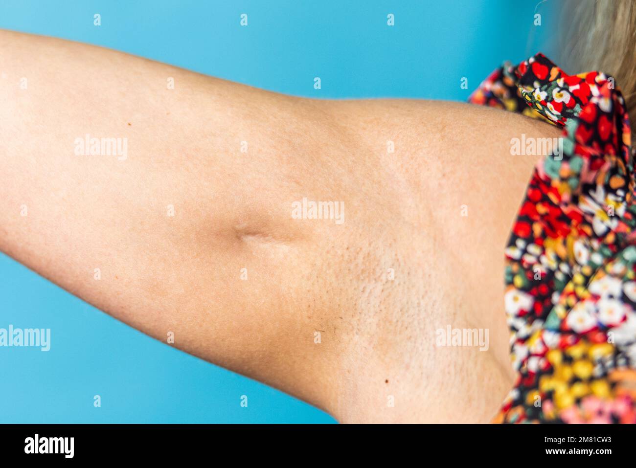 A close up image of a woman's athletic arm with muscles and a deep