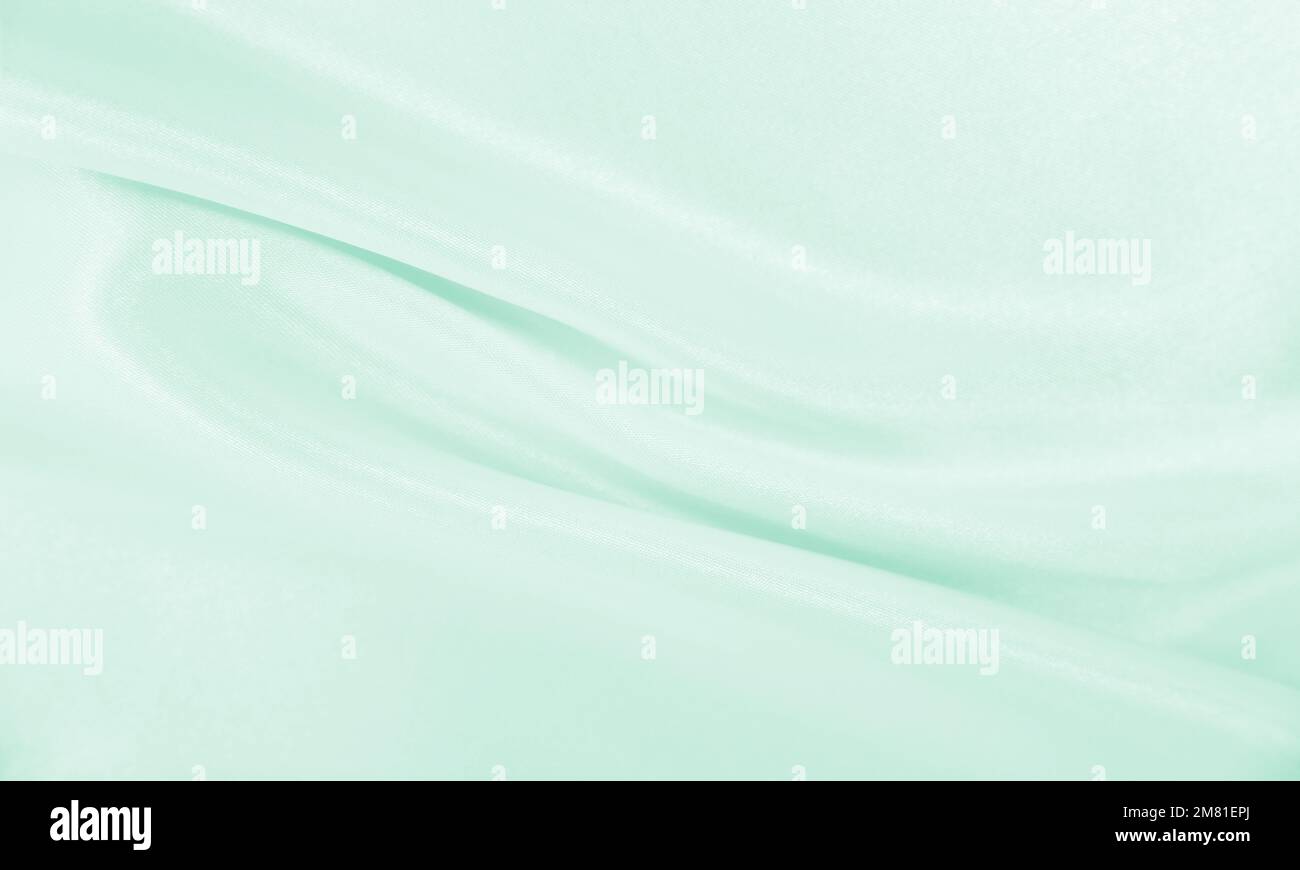 Smooth elegant green silk or satin luxury cloth texture can use as ...