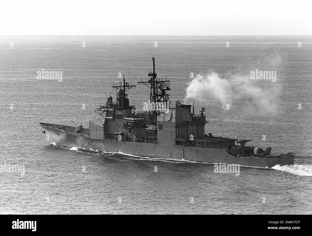 An aerial port quarter view of the Aegis guided missile cruiser USS