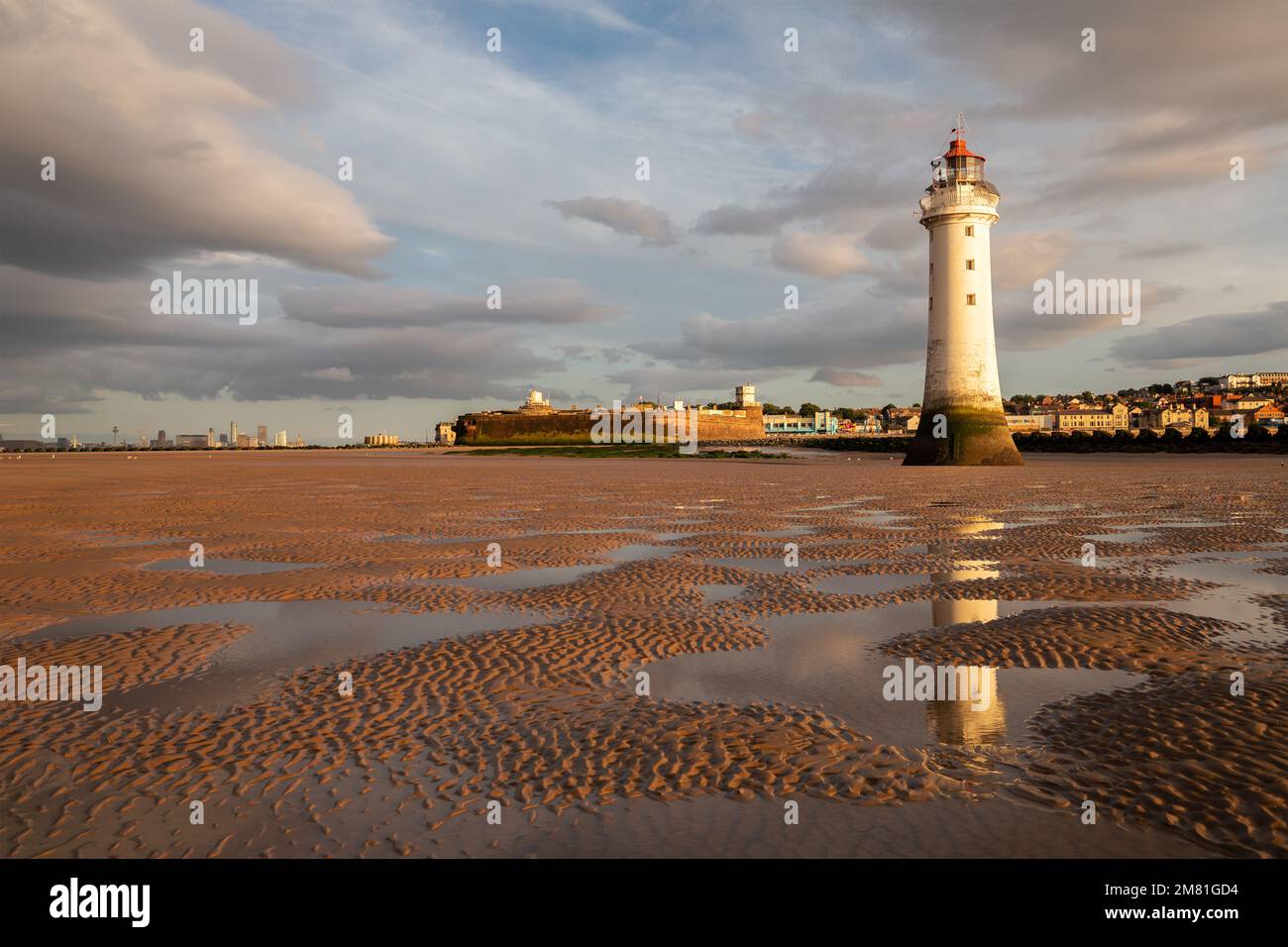 New Brighton UK Perch Rock Lighthouse Reflected In Water Pools At Low 