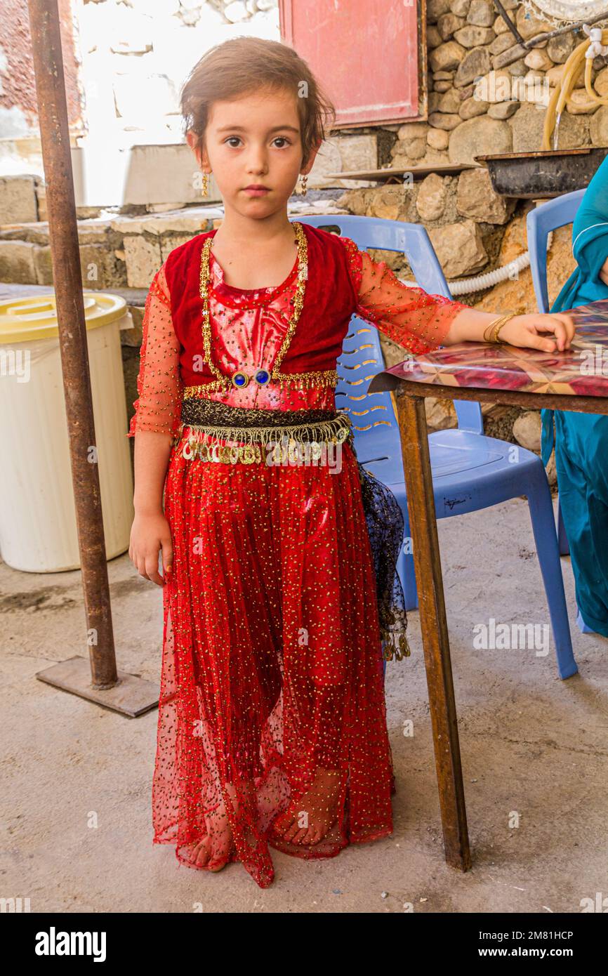 PALANGAN, IRAN - JULY 12, 2019: Girl wearing a traditional Kurdish dress in Palangan village in Kurdistan region, Iran Stock Photo