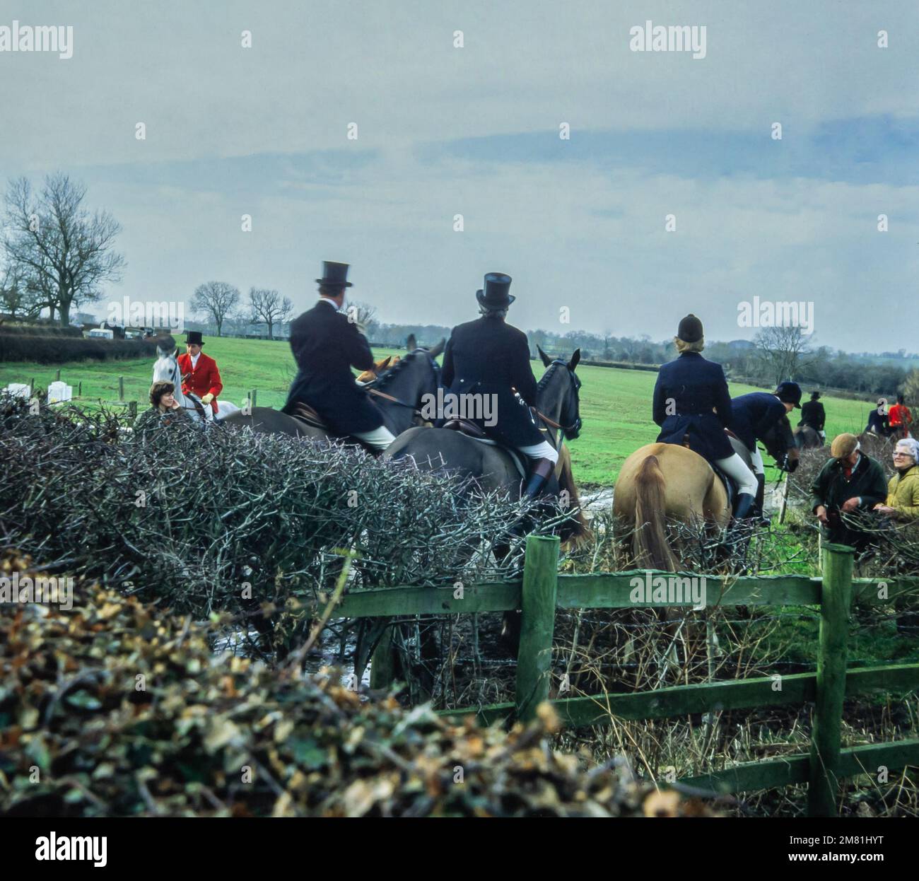 Fox hunting in Foxton, Leicestershire in 1982. This photo was taken from the original slide. Fox hunting has been recognised as a cruel sport and has been banned since 2004. Stock Photo