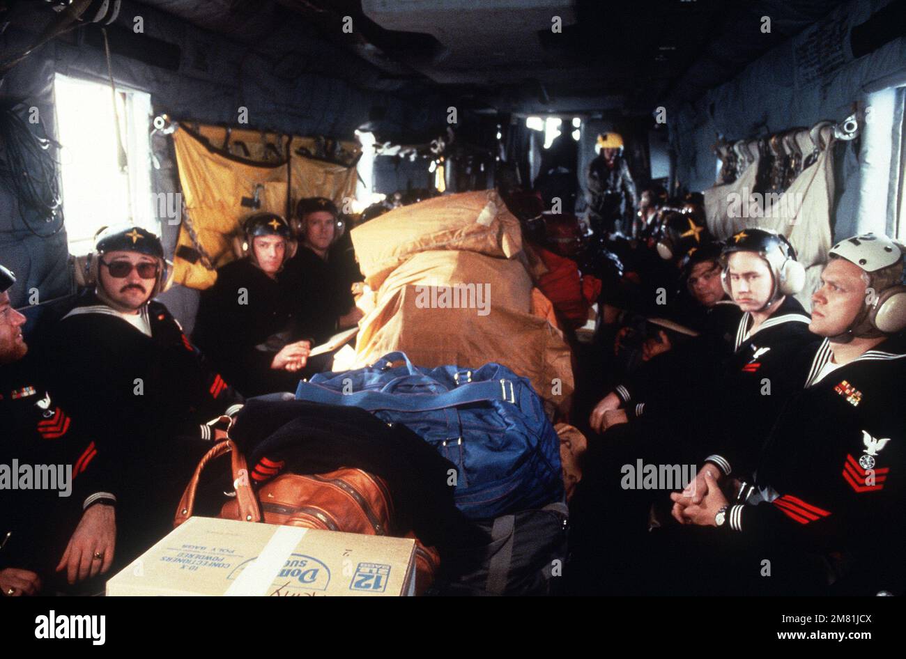 Reservists are transferred from the battleship USS NEW JERSEY (BB-62) aboard an H-53 Sea Stallion helicopter that will take them to Cyprus. On Cyprus, the reservists will board a C-9 Skytrain II aircraft for their trip back to the United States. Country: Mediterranean Sea (MED) Stock Photo