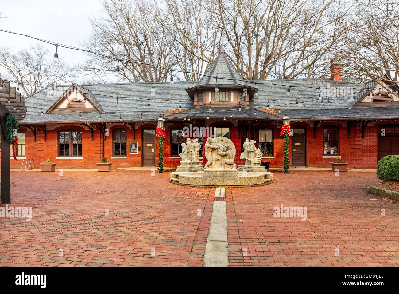 BURLINGTON, NC, USA-2 JAN 2023: Historic Burlington Train Depot with carved depictions of historical events in front. Stock Photo