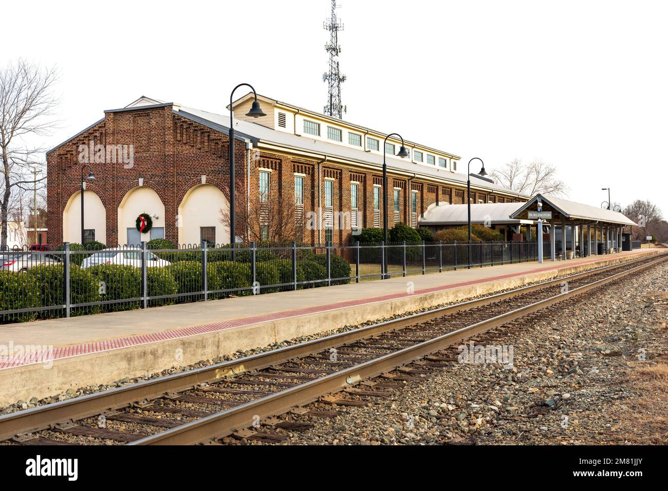 BURLINGTON, NC, USA-2 JAN 2023:The Amtrak Company Shops Station-building and tracks. Stock Photo