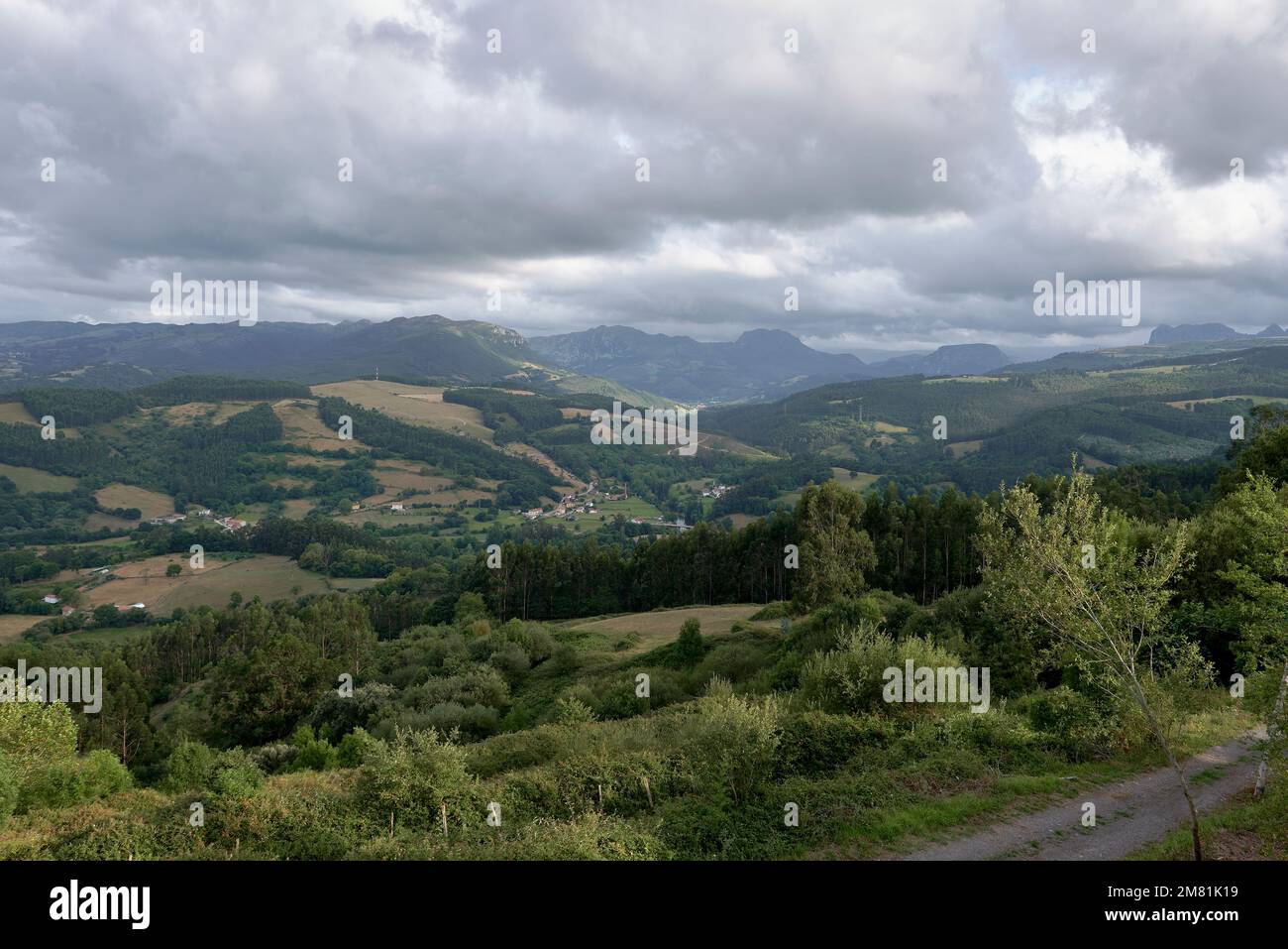 Rustic mountain landscape with cloudy sky.Bien Aparecida, Cantabria ...
