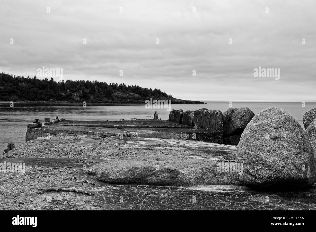The old dilapidated pier of Sandy Cove, Nova Scotia, in black and white. Stock Photo