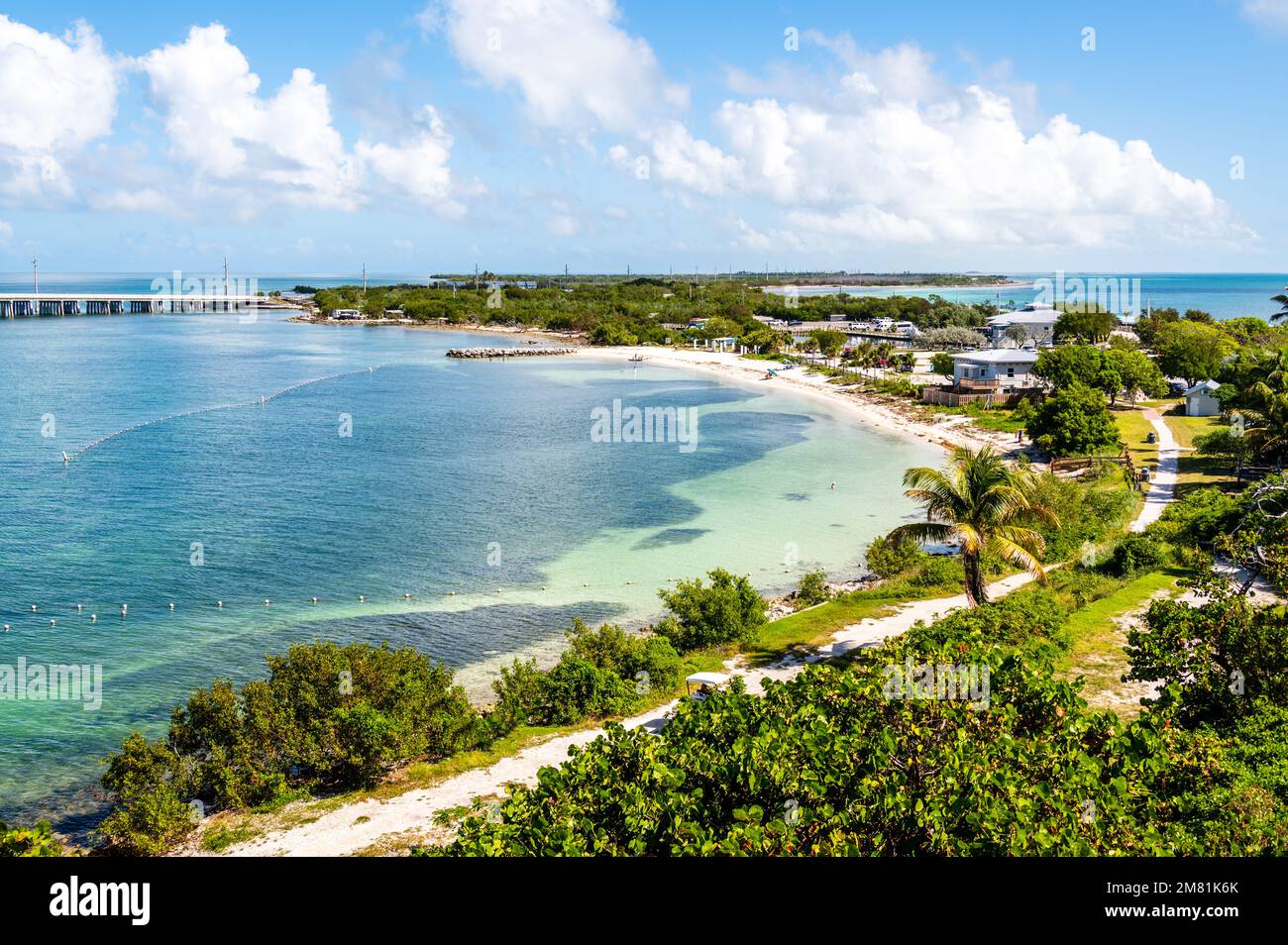 The aerial view of the crystal clear blue water by the beach at Bahia