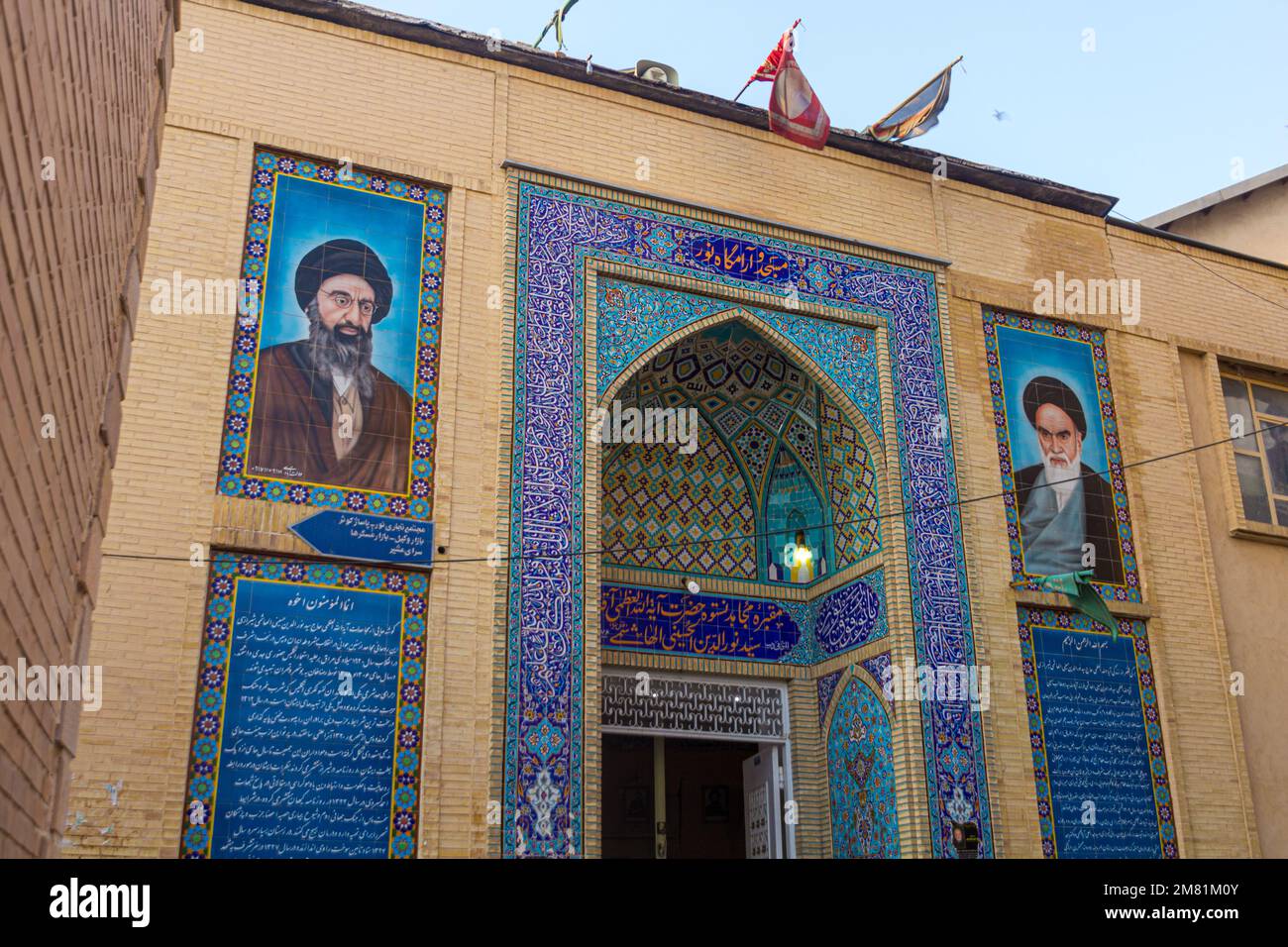 SHIRAZ, IRAN - JULY 6, 2019: Portraits of Ali Khamenei and Ruhollah Khomeini on a building in Shiraz, Iran. Stock Photo