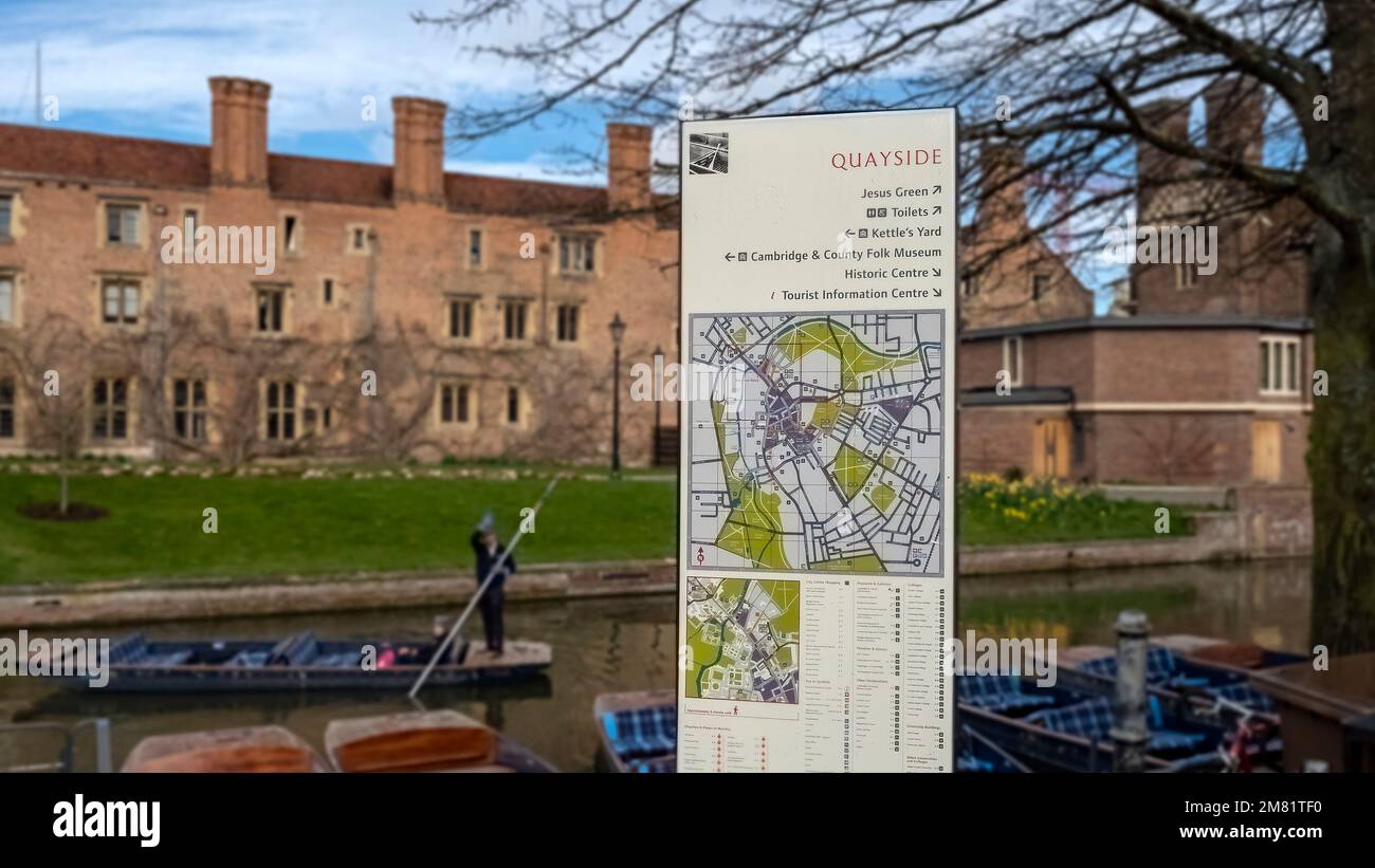 CAMBRIDGE, UK - MARCH 11, 2020:  Tourist information at the Quayside with defocused view of River Cam and Magdalene College in the background Stock Photo