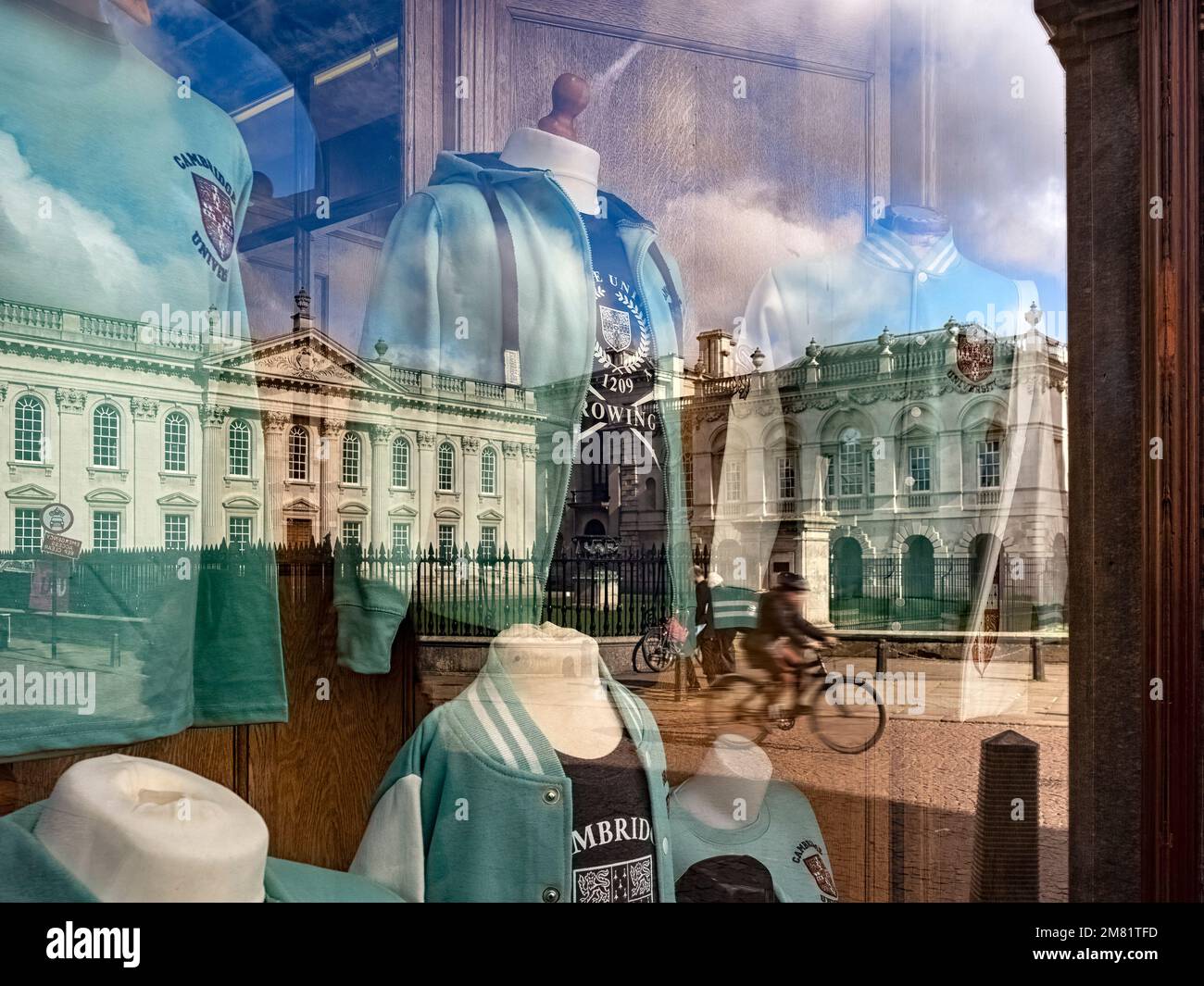 CAMBRIDGE, UK - MARCH 11, 2020:  View of Cambridge University Senate House building reflected in souvenir shop selling branded clothing Stock Photo