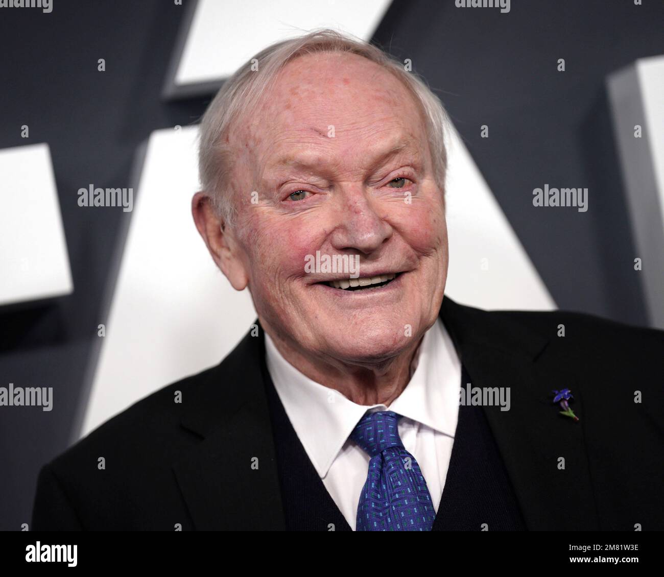 Julian Glover poses for photographers upon arrival at the premiere of