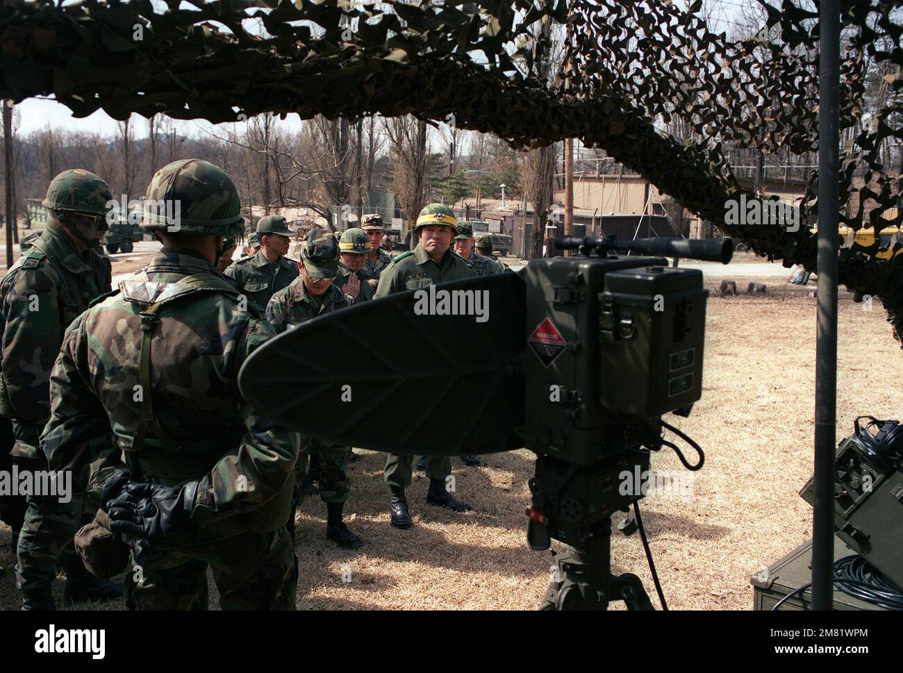 LT. GEN. Kim Dong Chun, center, commander, III Corps, South Korean army, inspects electronic equipment displayed by the 125th Signal Bn., 25th Inf. Div., during the joint South Korean/U.S. exercise Team Spirit '84. AN/PPS-5 ground surveillance equipment is visible in the foreground. Subject Operation/Series: TEAM SPIRIT '84 Base: Wonju Country: South Korea Stock Photo