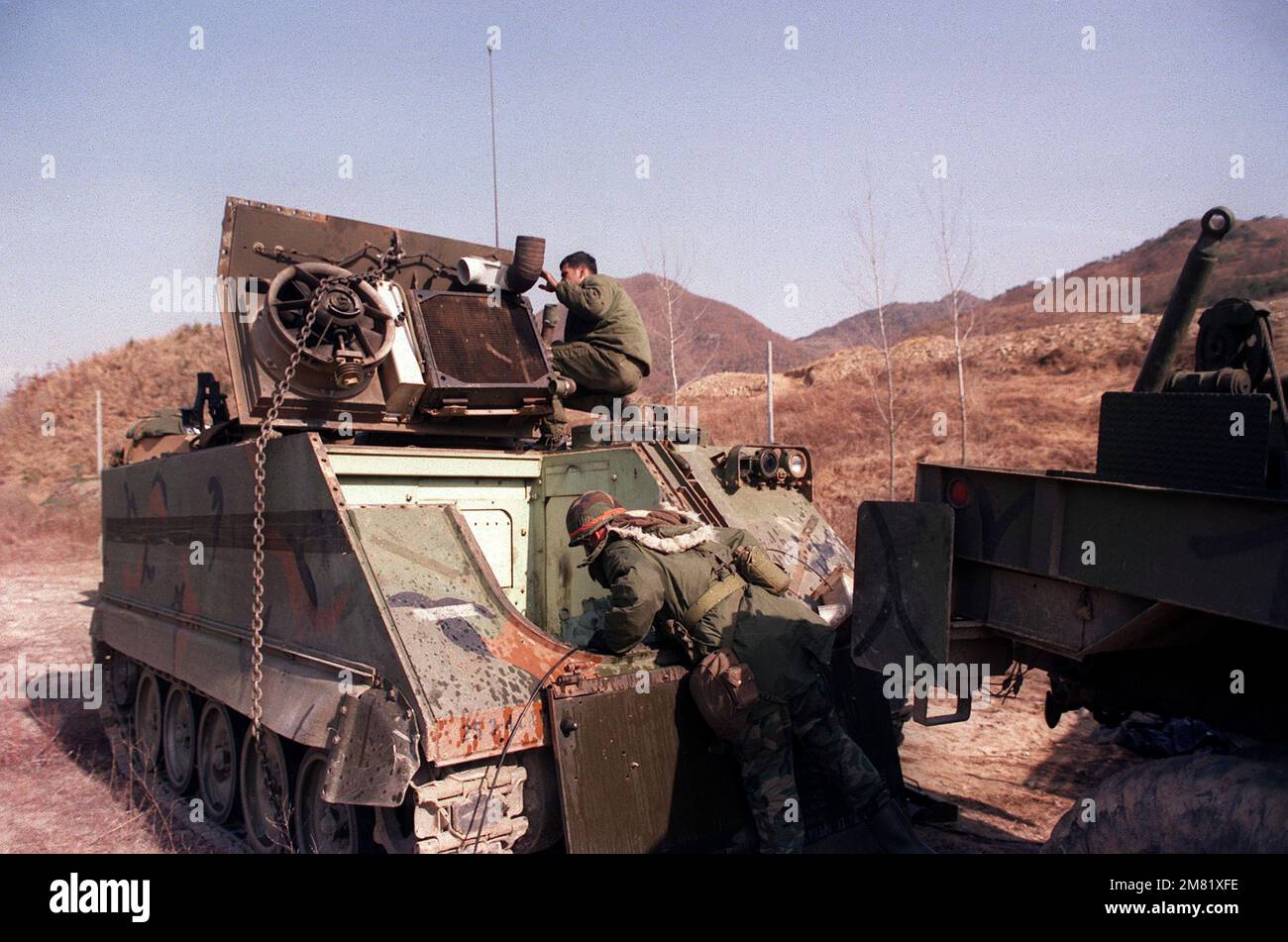 Members of the 2nd Forward Support Bn., 25th,. Inf. Div., perform maintenance on an M-113A2 armored personnel carrier during the joint South Korean/U.S. training exercise Team Spirit '84. Subject Operation/Series: TEAM SPIRIT '84 Base: Hongchon Country: Republic Of Korea (KOR) Stock Photo