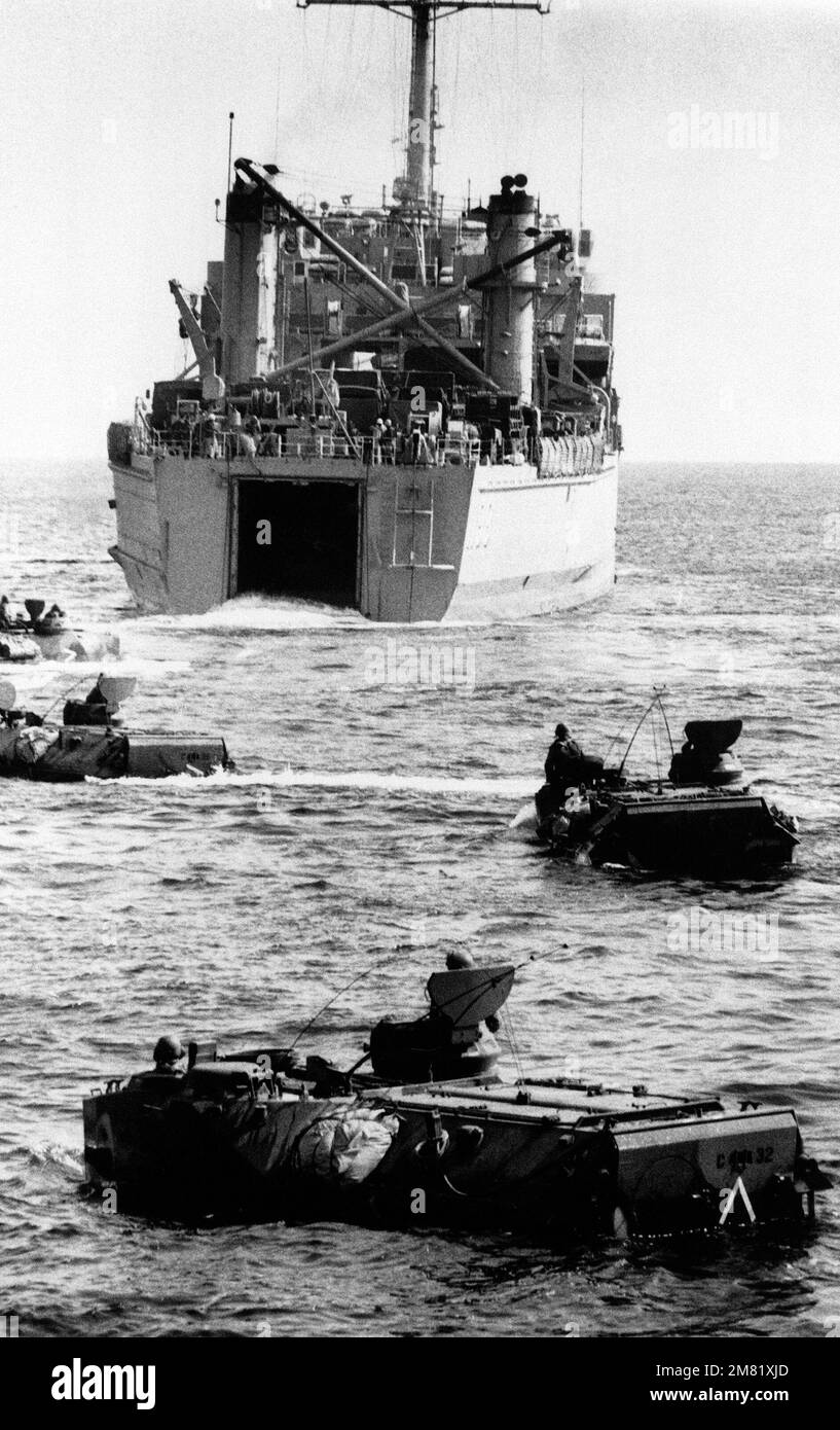 US Marine tracked landing vehicles circle the tank landing ship USS BRISTOL COUNTY (LST 1198) prior to a TEAM SPIRIT '84 amphibious landing. TEAM SPIRIT is a joint/combined operation designed to test and improve techniques to defend the Republic of Korean Peninsula and increase combat readiness of Republic of Korea and US armed forces. Subject Operation/Series: TEAM SPIRIT 84 Base: Tok Sok Ri Beach Country: Republic Of Korea (KOR) Stock Photo