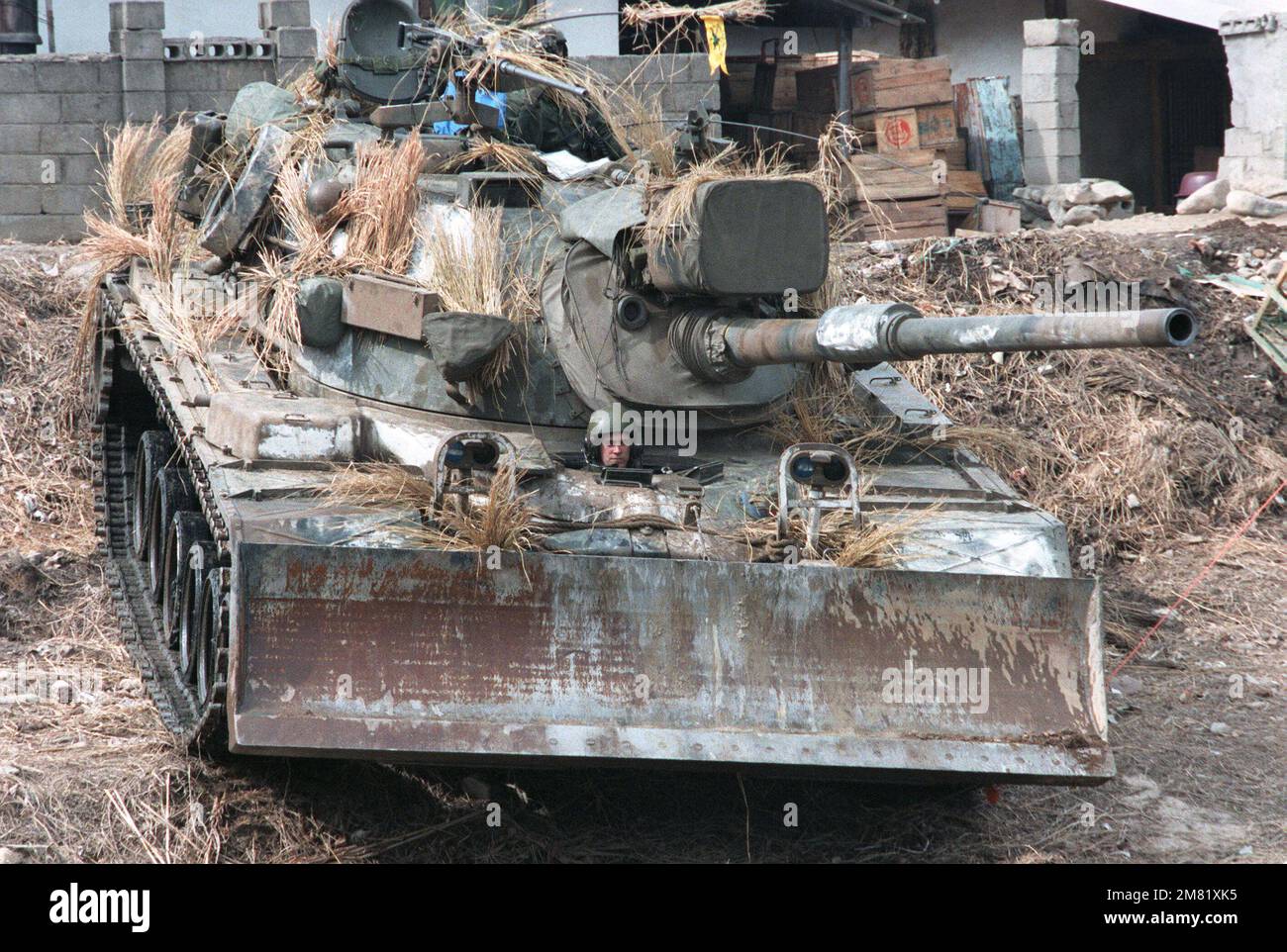 An M-48A5 main battle tank, with a bulldozer blade on the front, is set up during the joint South Korea/US Exercise Team Spirit '84. Subject Operation/Series: Team Spirit '84 Country: Republic Of Korea (KOR) Stock Photo