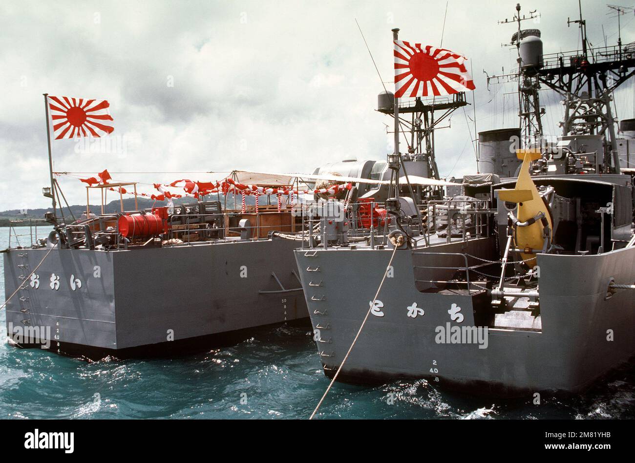 Starboard quarter view of the Japanese frigates JDS TOKACHI (DE 218), right, and JDS OOI (DE 214) moored in Apra Harbor. Base: Naval Station, Guam State: Guam (GU) Country: Northern Mariana Islands (MNP) Stock Photo