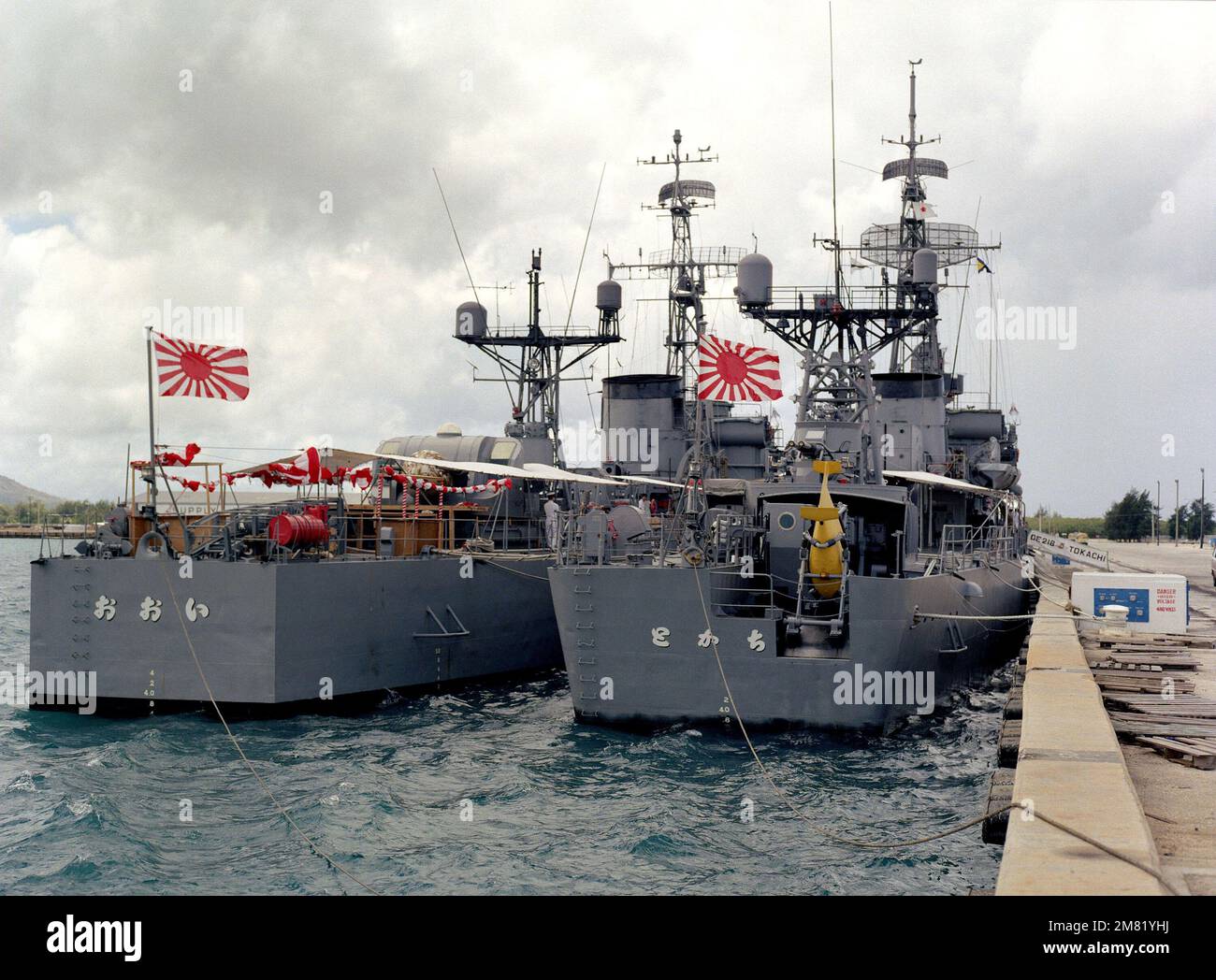 Starboard quarter view of the Japanese frigates JDS TOKACHI (DE 218), right, and JDS OOI (DE 214) moored in Apra Harbor. Base: Naval Station, Guam State: Guam (GU) Country: Northern Mariana Islands (MNP) Stock Photo