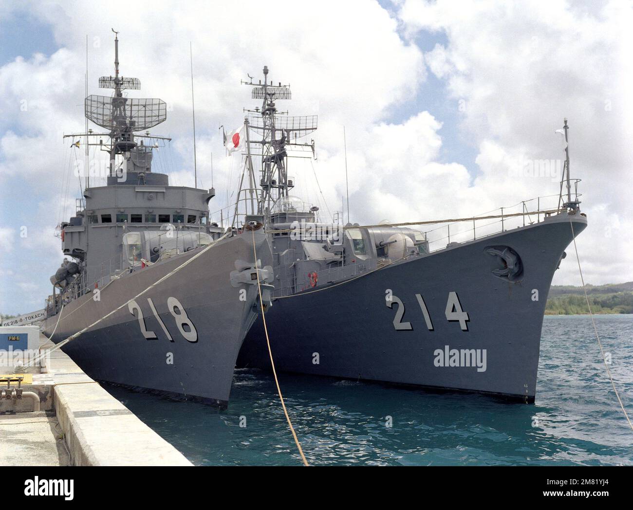 Starboard bow view of the Japanese frigates JDS TOKACHI (DE 218), left, and JDS OOI (DE 214) moored in Apra Harbor. Base: Naval Station, Guam State: Guam (GU) Country: Northern Mariana Islands (MNP) Stock Photo