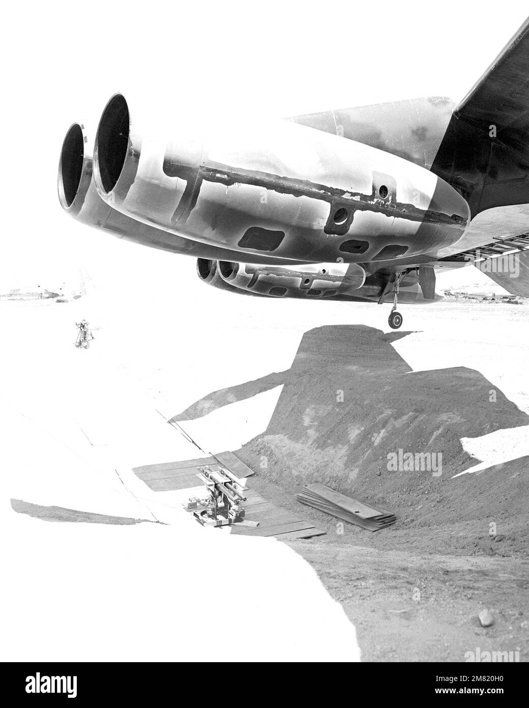 An audiovisual crew sets up a camera near a firing pit at the Military ...
