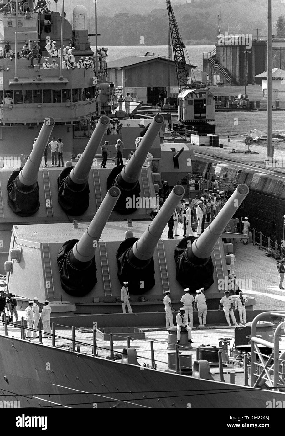 A view of the forward 16-inch guns aboard the battleship USS NEW JERSEY ...