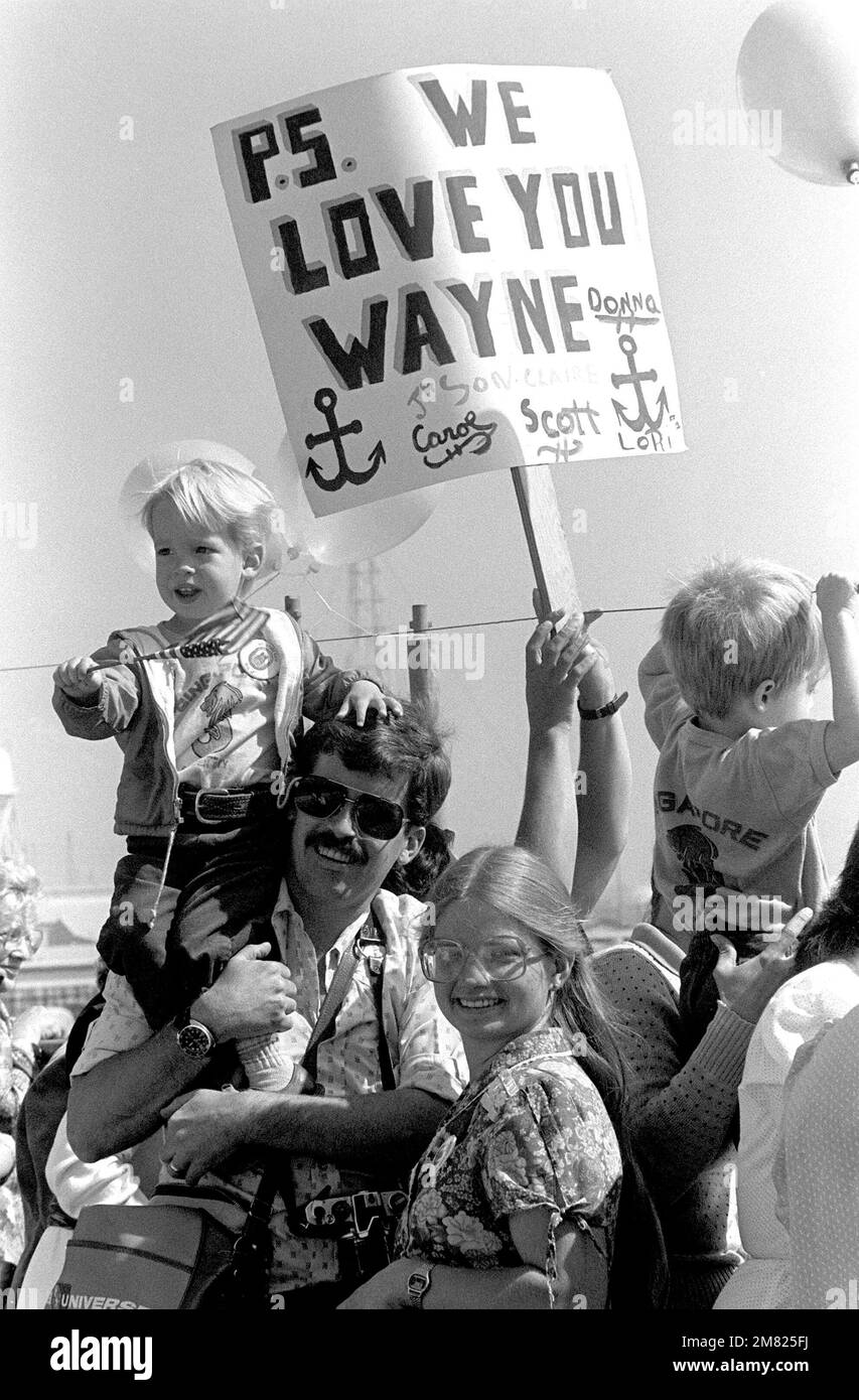 Family members and friends wait on the dock to greet the USS NEW JERSEY