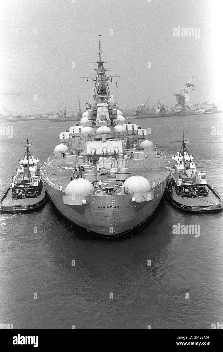 commerial-tugs-assist-in-towing-the-battleship-missouri-bb-63-to-long