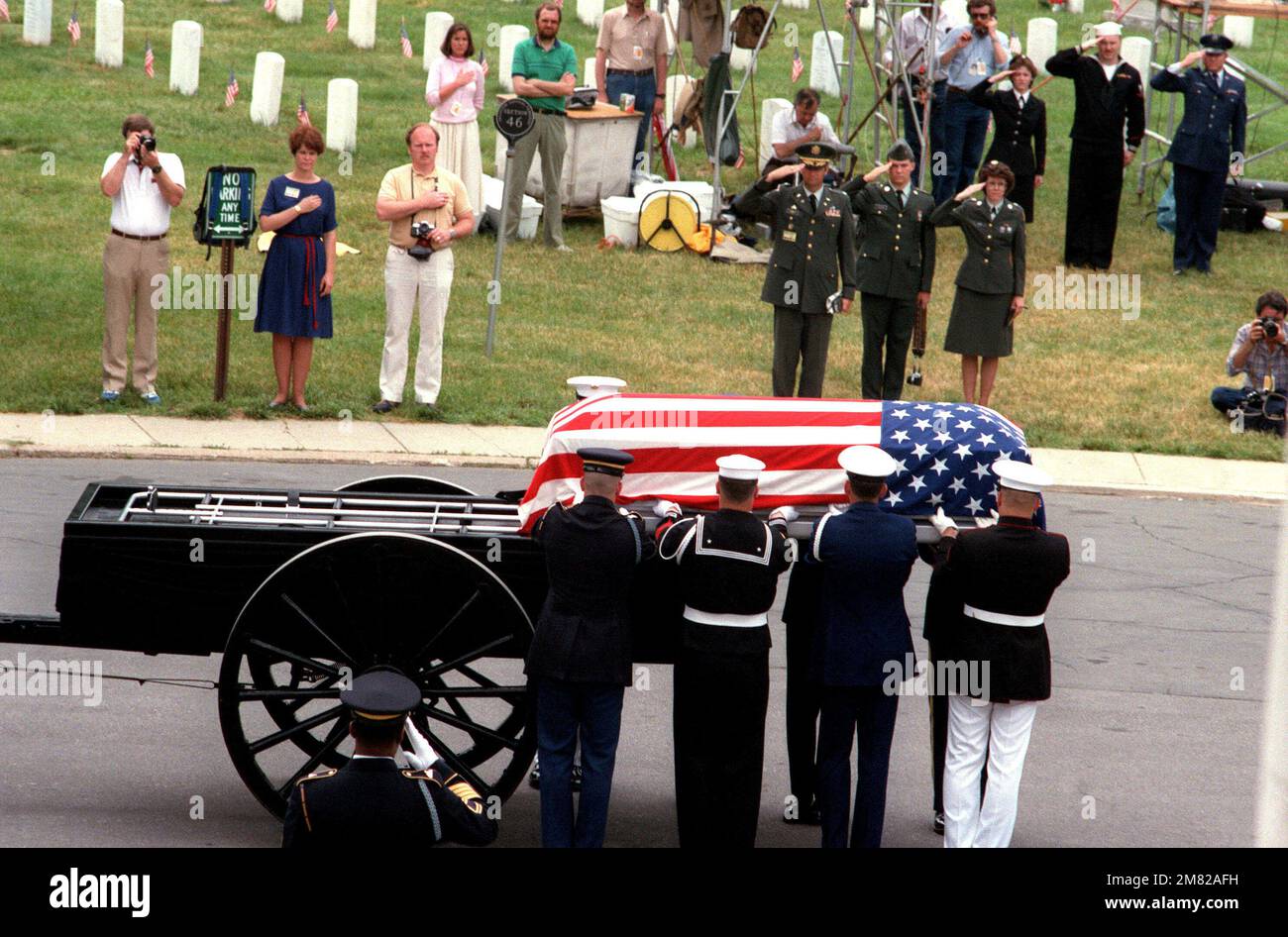 Pallbearers lift the casket bearing the remains of the Unknown