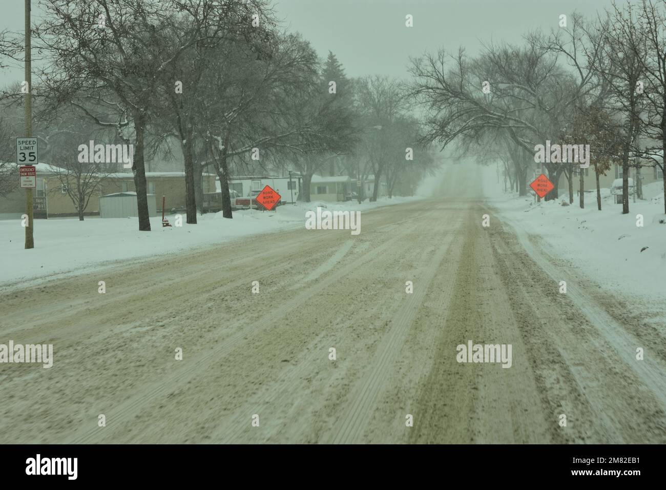 Snow is piled along streets of Bismarck, North Dakota from heavy