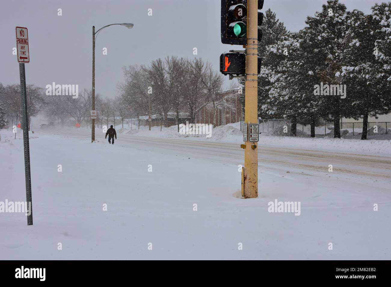 Snow is piled along streets of Bismarck, North Dakota from heavy