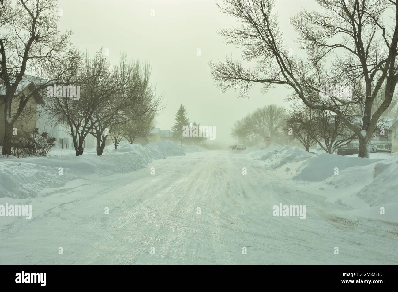 Snow is piled along streets of Bismarck, North Dakota from heavy 