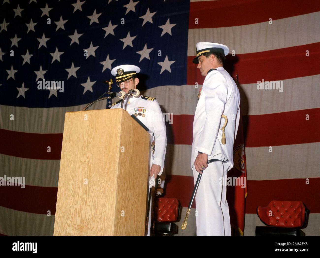 Commander (CDR) Thomas S. Robison reads his orders during the ceremony in which he is relieving CDR Robert S. Weber as Commanding Officer of Tactical Electronic Warfare Squadron 132 (VAQ-132). Base: Naval Air Station Whidbey Island State: Washington (WA) Country: United States Of America (USA) Stock Photo